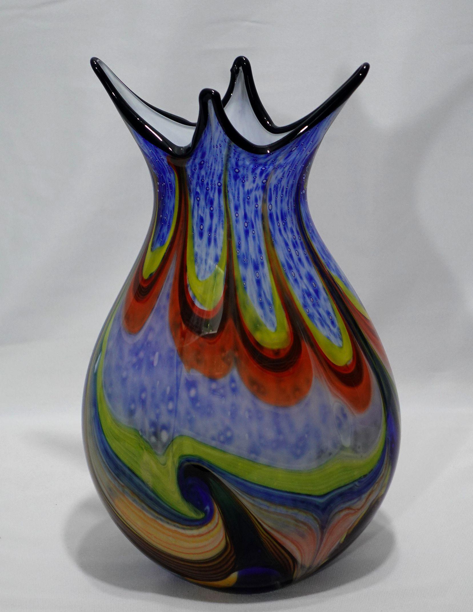 A Large and Heavy Murano Hand Blown Murrine Glass Vase, colorful artwork with a shaped top.