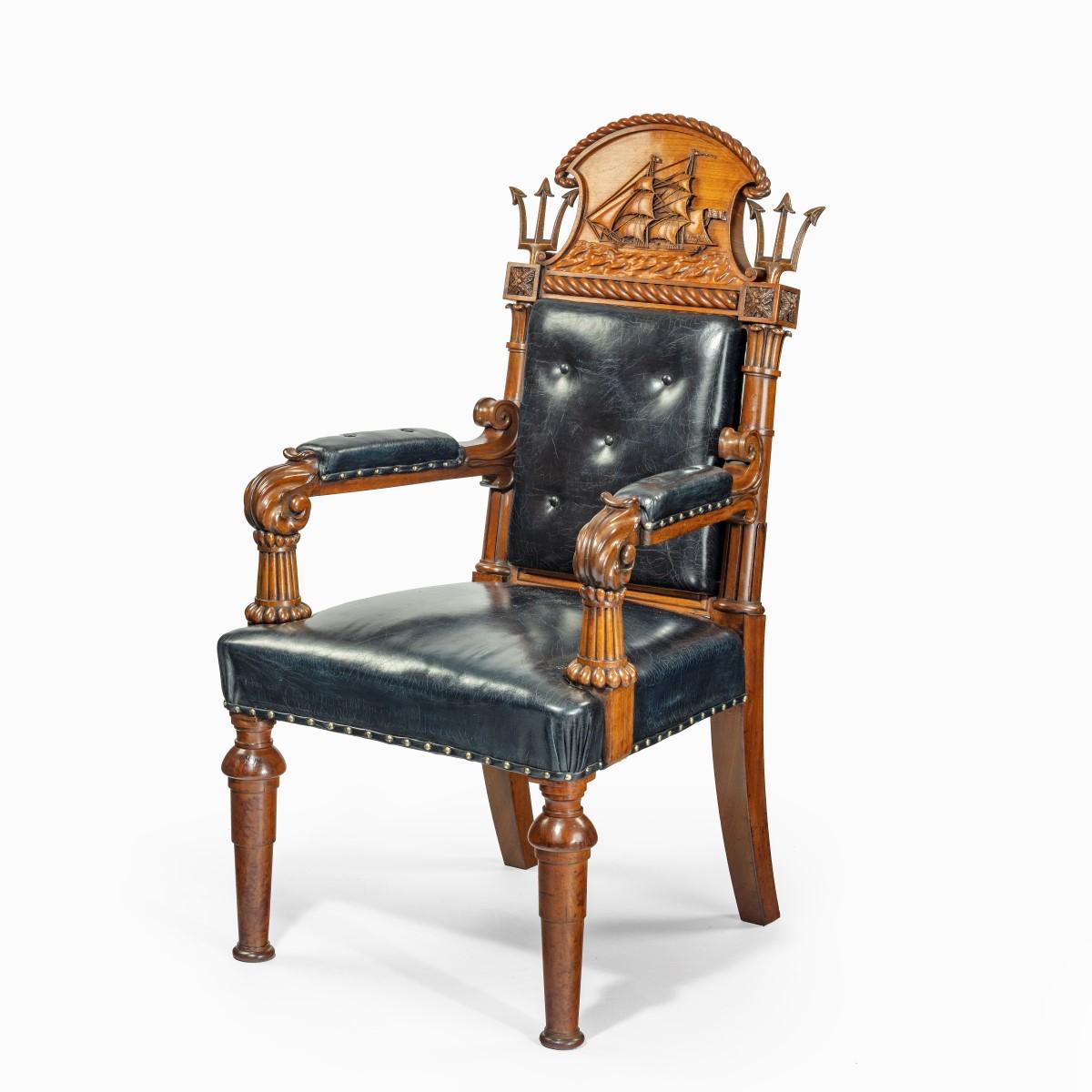 A large and imposing Regency nautical chair made for the Alliance assurance company, the rectangular leather covered back, padded arms and seat surmounted by a cresting rail with a shaped central panel carved with a three masted ship in full sail