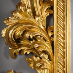 A Large and Impressive Baroque Style Carved Giltwood Mirror