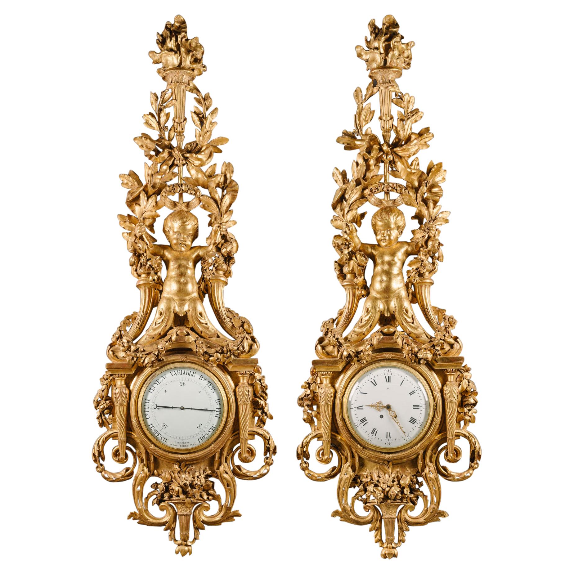 Grand ensemble d'horloge et de baromètre en bois doré sculpté de style Louis XVI