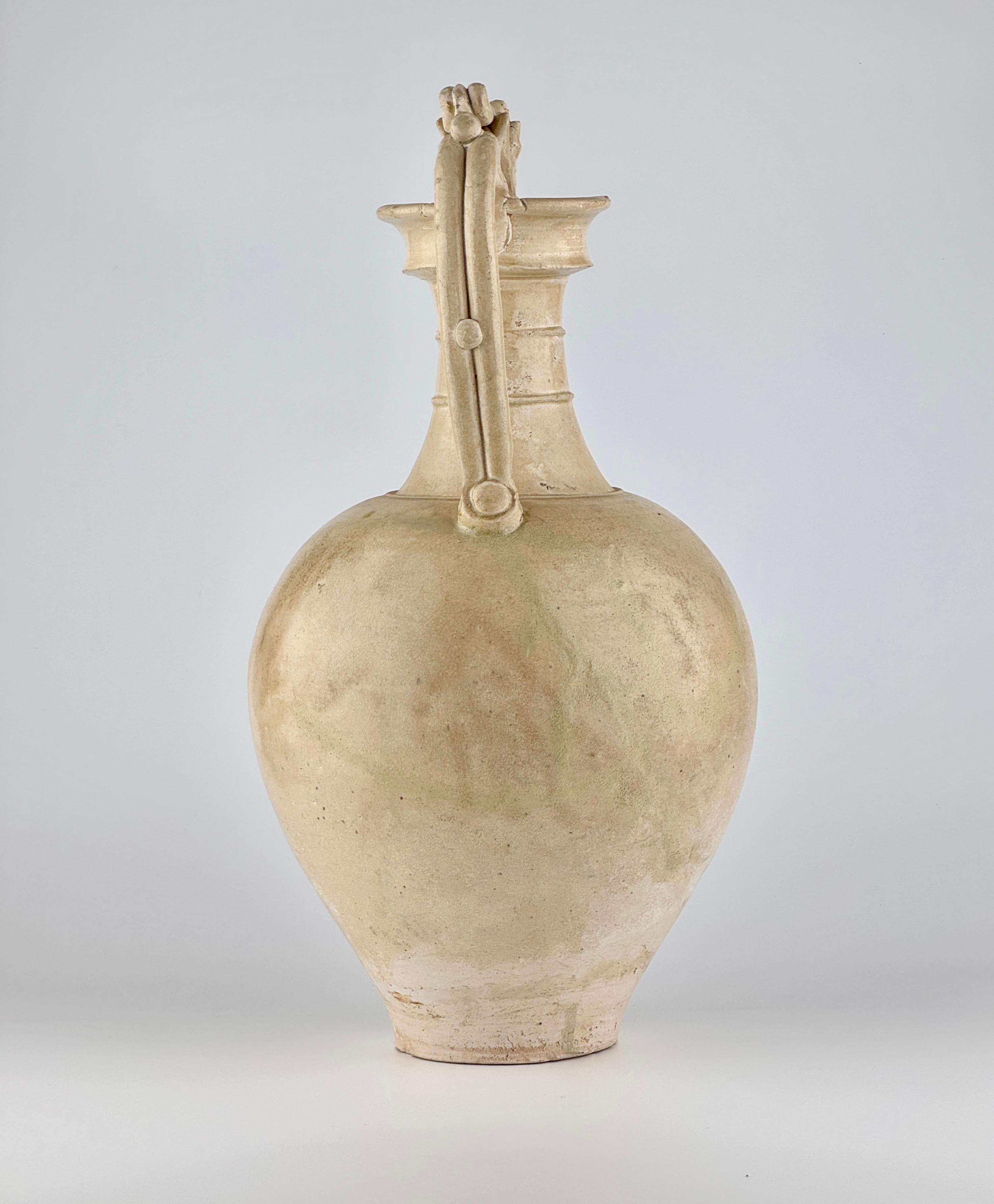 The ovoid shape suggests the influence from “amphora” of Greece and Rome, while the dragon-shaped handles allude to Persian and Central Asian metalwork. The ubiquitous dragon is a East Asian addition to this type of vessel.

A pair of double-strap