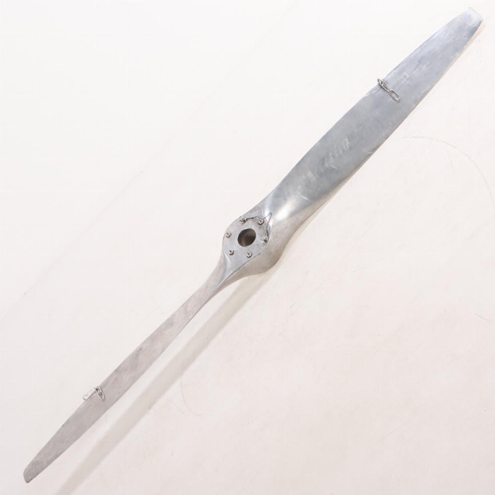 American A large and sculptural Sensenich brand aluminum airplane propeller.