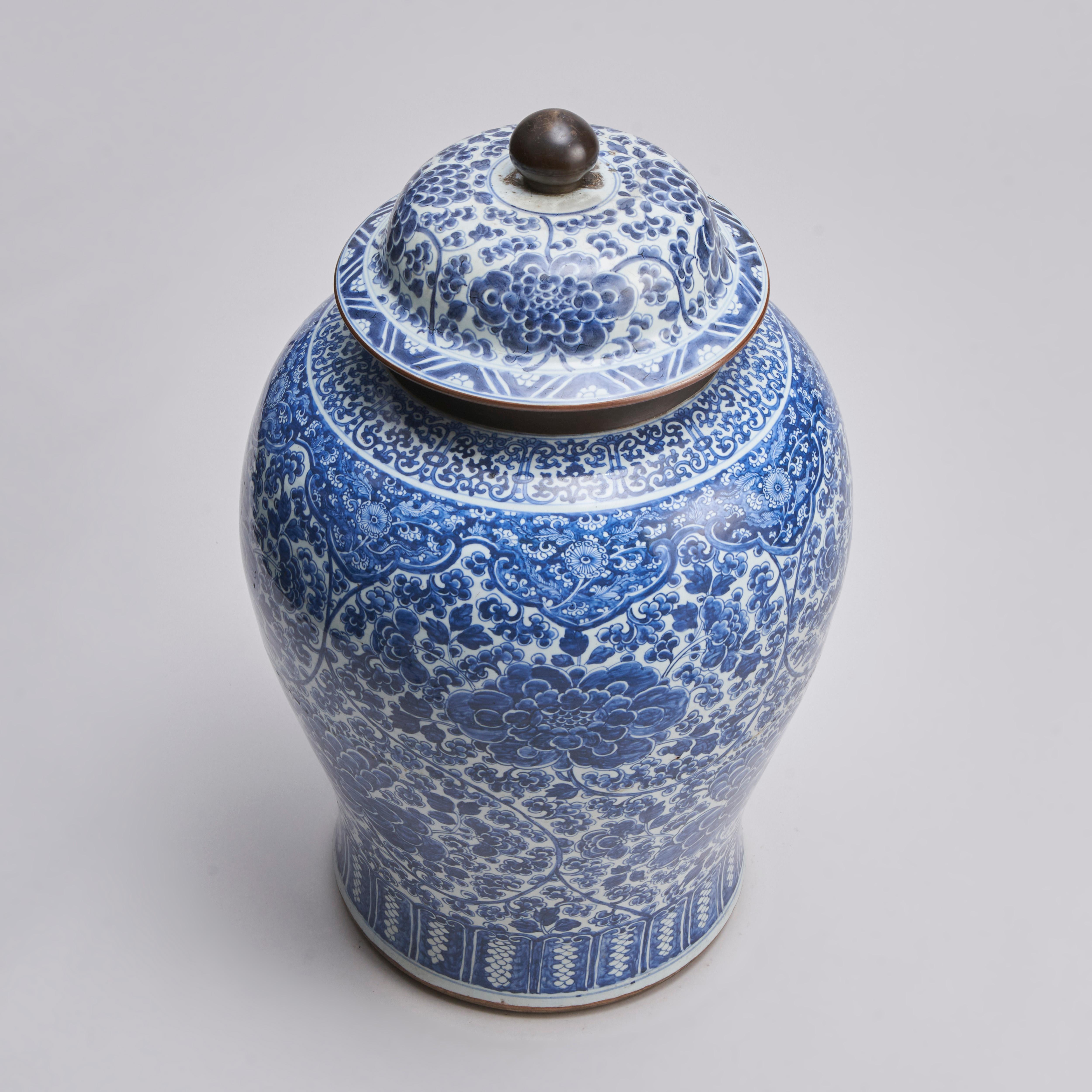 A large 19th century Chinese blue and white temple jar and cover with intricate decoration of large blousey peonies on a foliate ground. The rim and knop of the jar with a choclate brown glaze.

Please feel free to contact us for further information