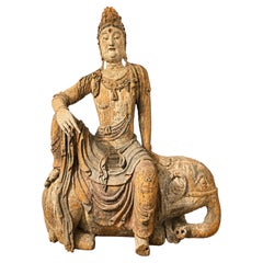 A Large Antique Chinese Carved Timber Figure of Guanyin Riding an Elephant