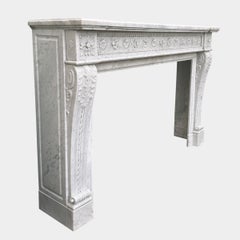 A large Antique French Carrara Marble Fireplace Mantel