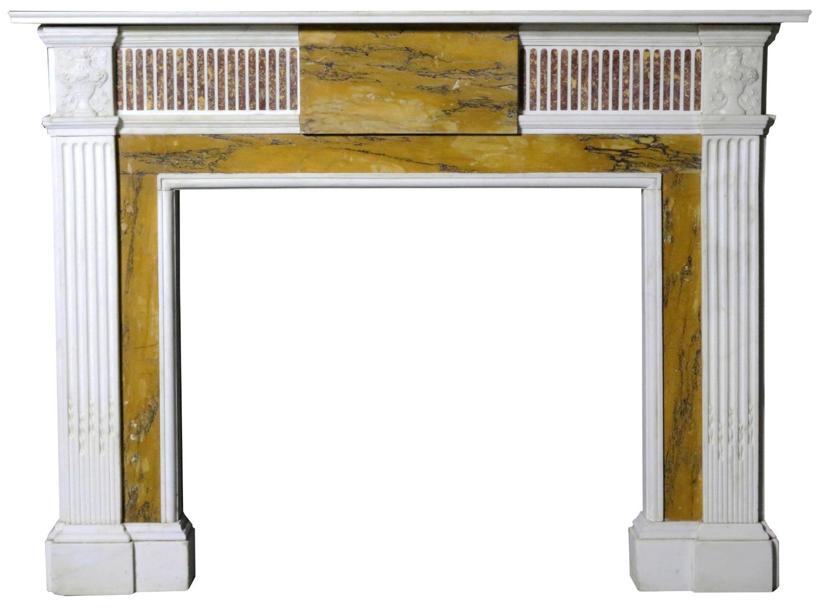A good quality mid-19th century English, George III style chimneypiece. Constructed from White Statuary, Sienna and Breccia marbles, with carved Statuary marble end blocks. Reclaimed from a house in London.

Opening H 98 x W 111 cm.