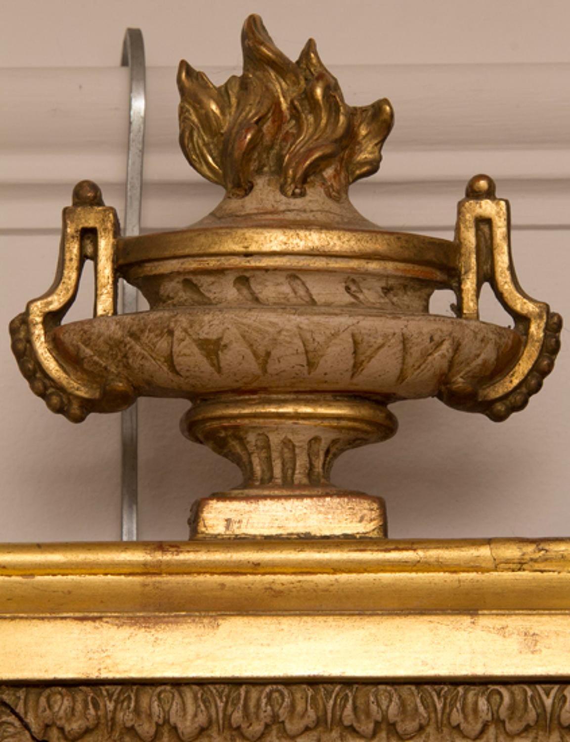 Superb detailed gilded frame featuring a Greek key, flaming urns and a floral rosette. Original bevelled glass and backboards.
   