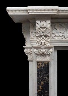 A large antique Italian Carrara marble renaissance style mantel fireplace