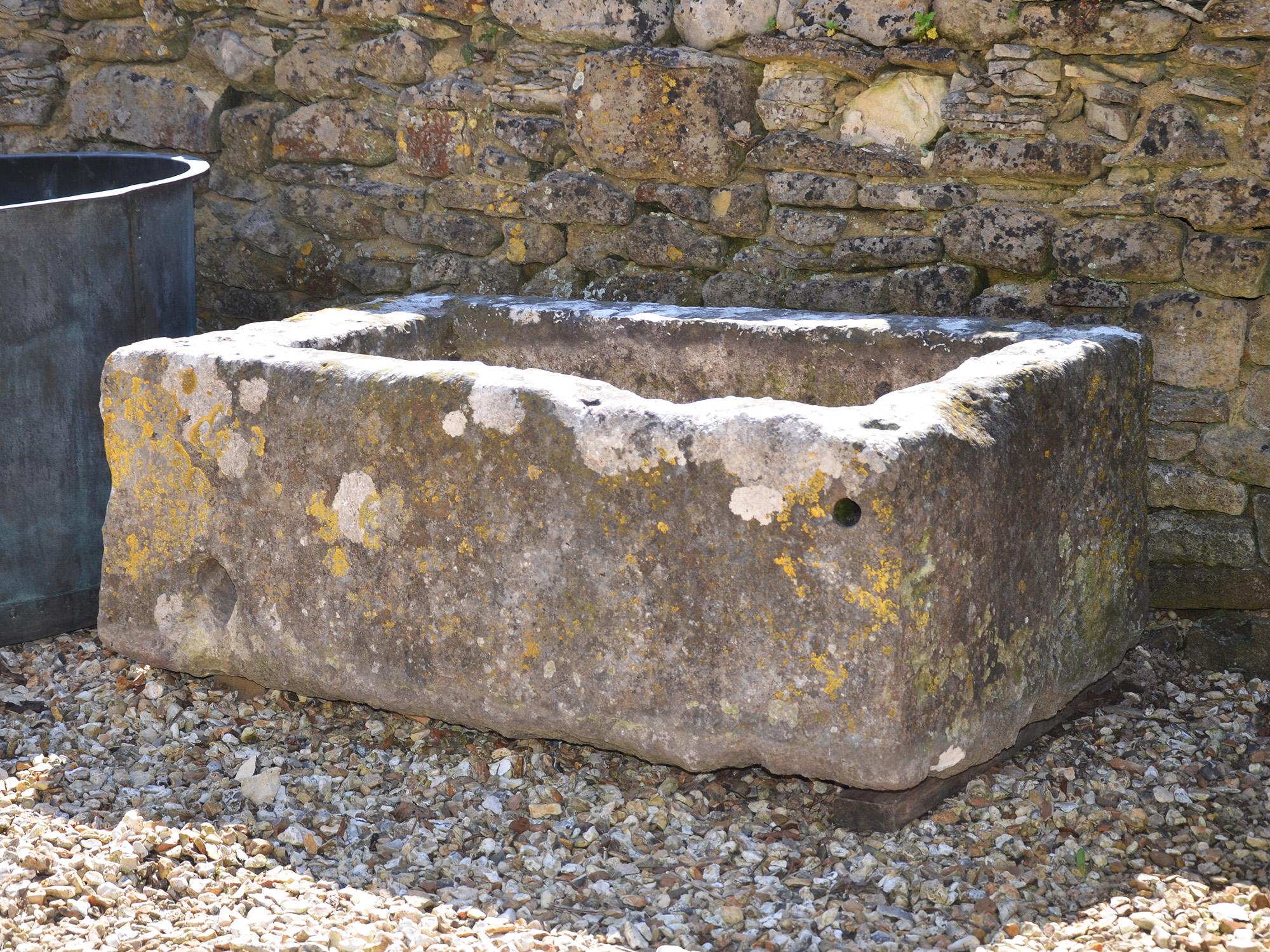 Large antique limestone trough with good weathering and patination.