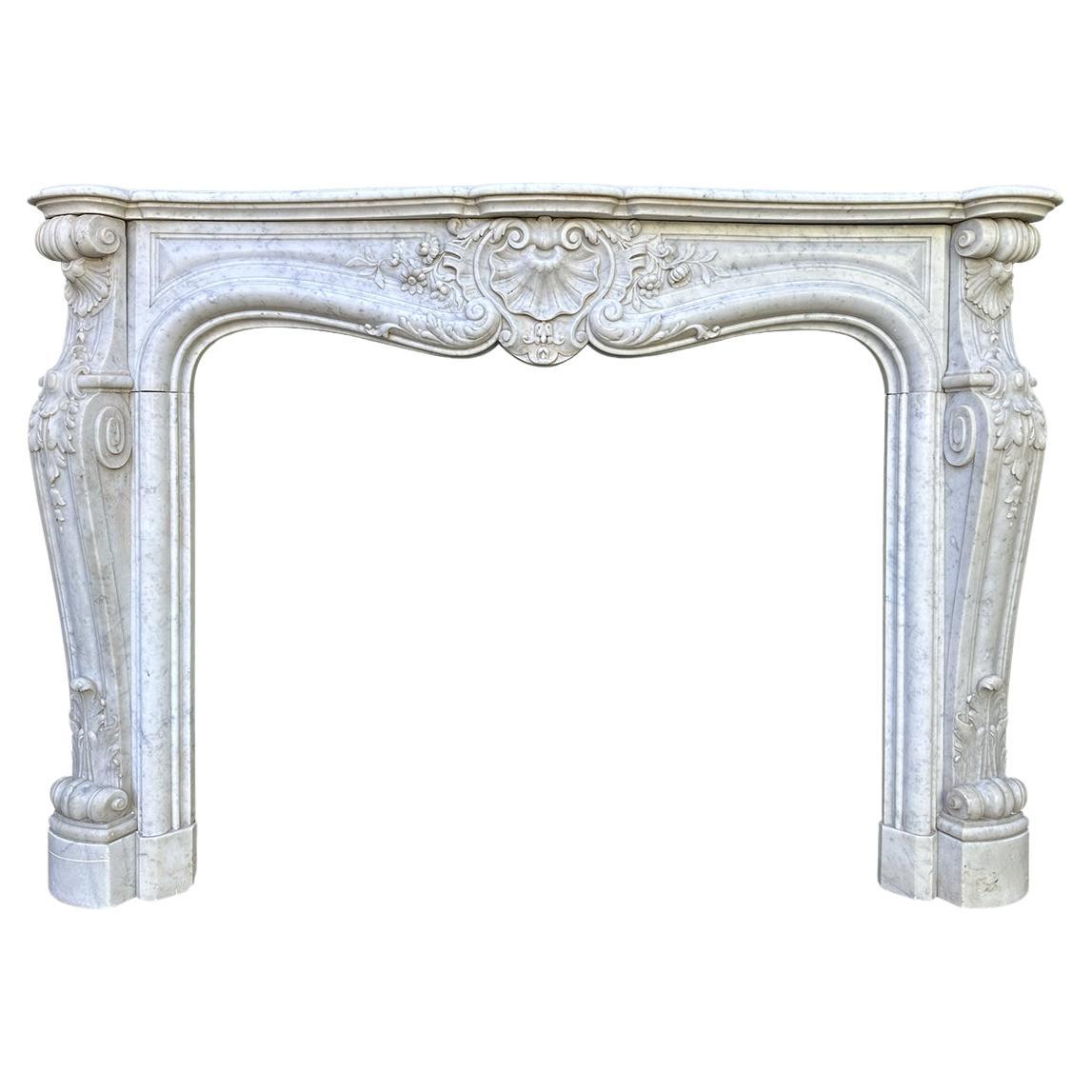 A large Antique Louis XV French Rococo Carved Marble Fireplace Mantel For Sale