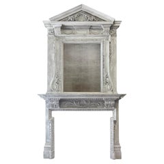 A large Antique painted wooden fireplace with overmantel mirror