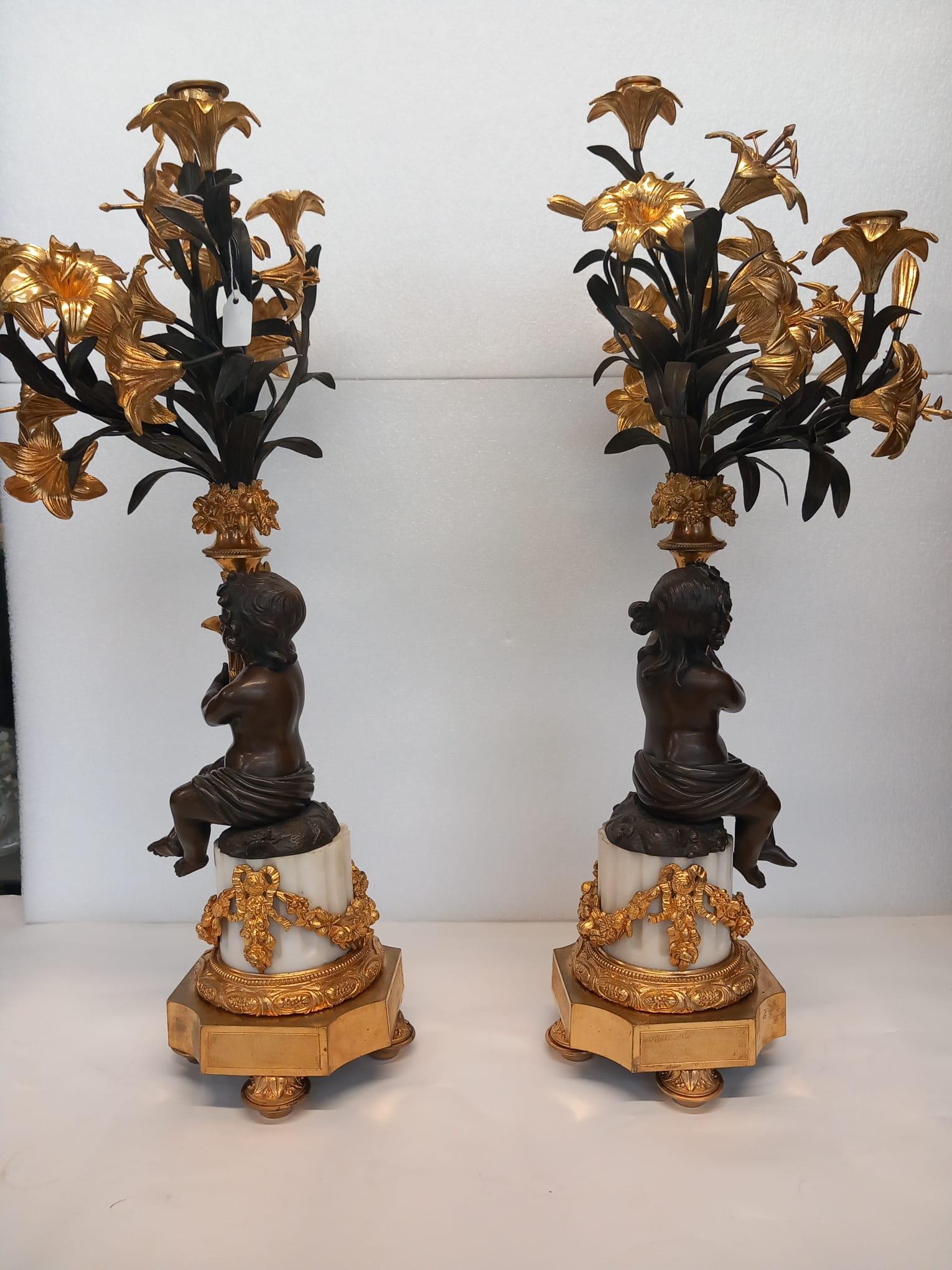 19th Century A large antique pair of French neoclassical candelabra in dark and gilt bronze  For Sale