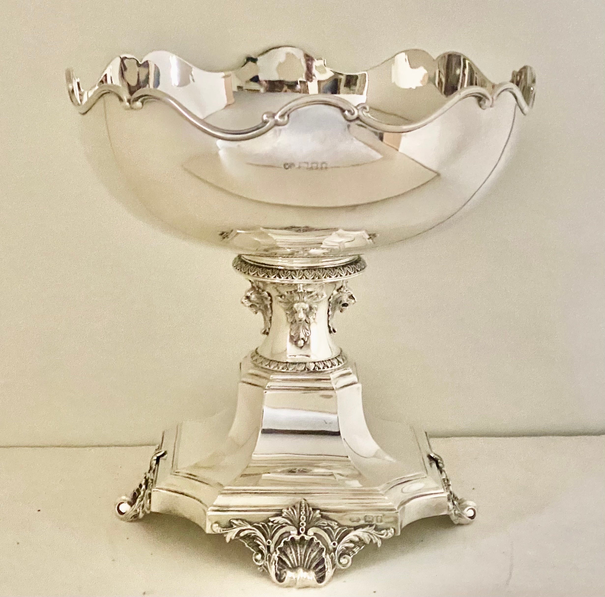 Antique 19th century Victorian solid silver centerpiece bowl, impressive Size and highly decorative, of shaped circular form with four paw feet, the sides applied with lion masks 
Each part is Hallmarked English Silver (925 Standard), London,