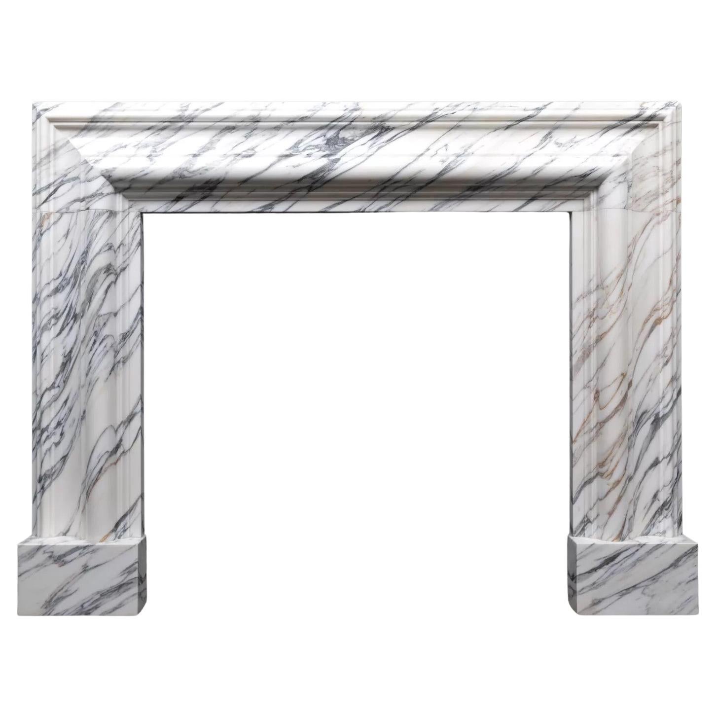 A large Arabescato marble bolection mantel by Ryan & Smith For Sale