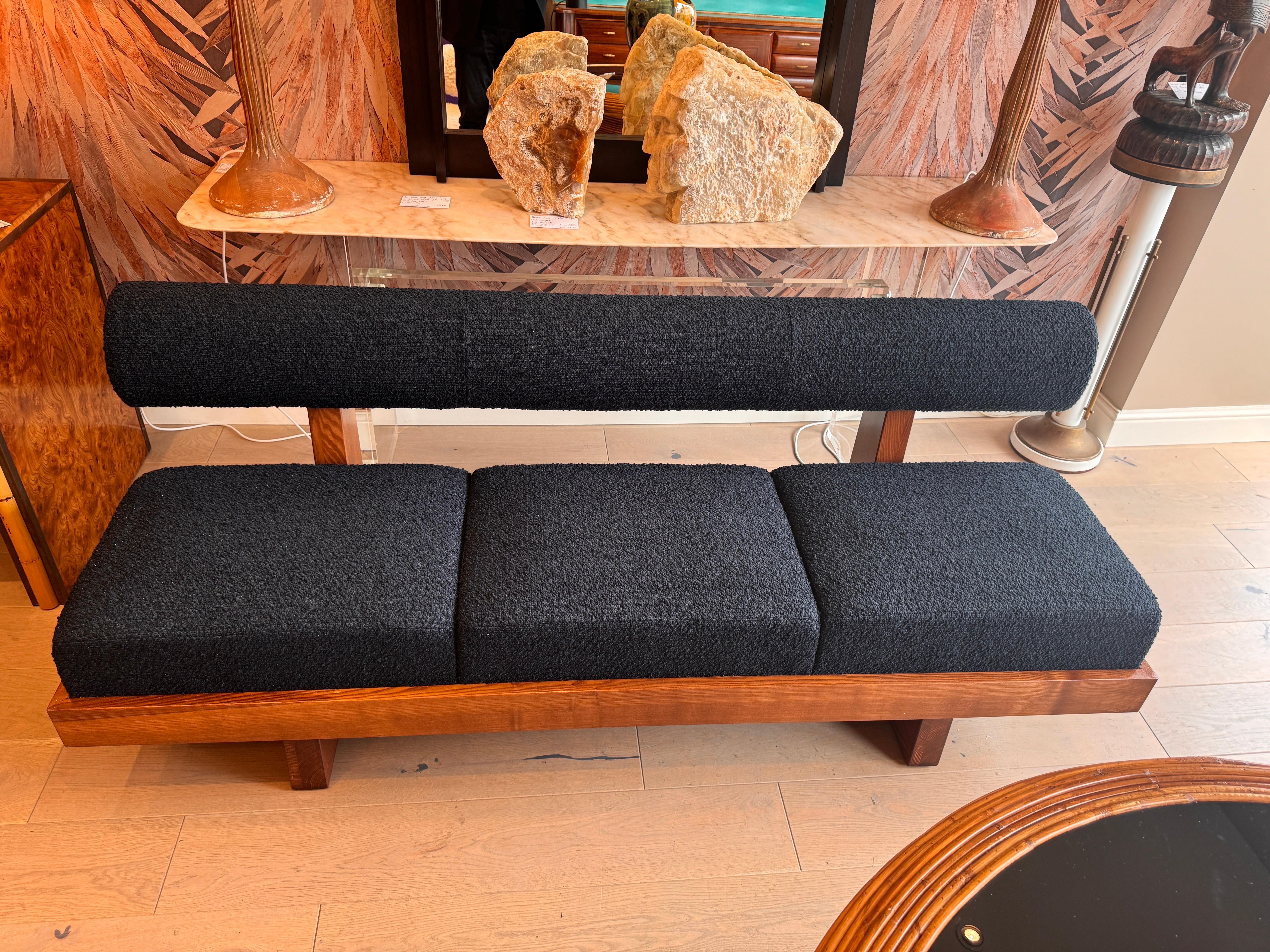 Italian A large architectural bench with a back rest in navy blue boucle . For Sale
