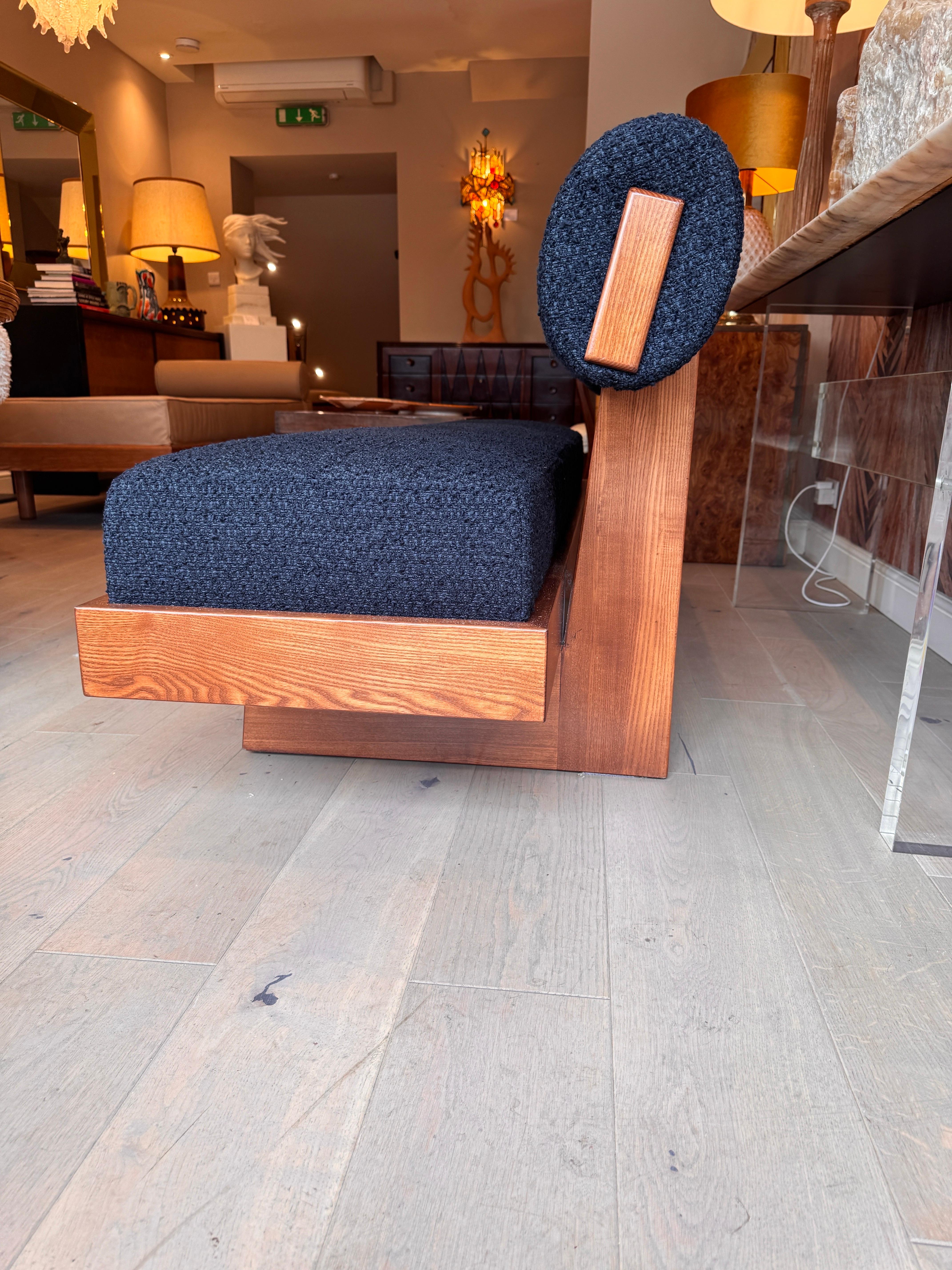 Contemporary A large architectural bench with a back rest in navy blue boucle . For Sale