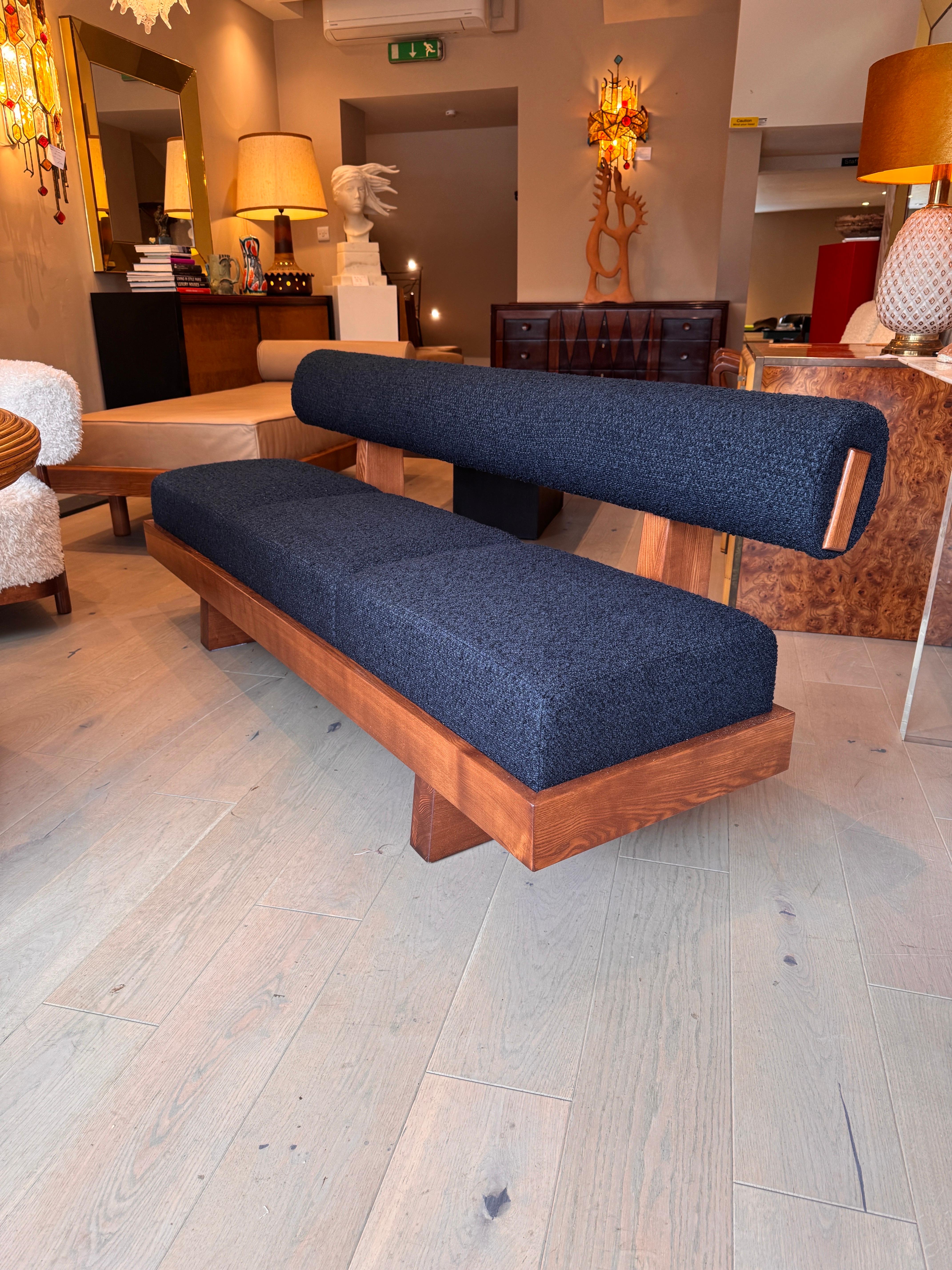 Bouclé A large architectural bench with a back rest in navy blue boucle . For Sale