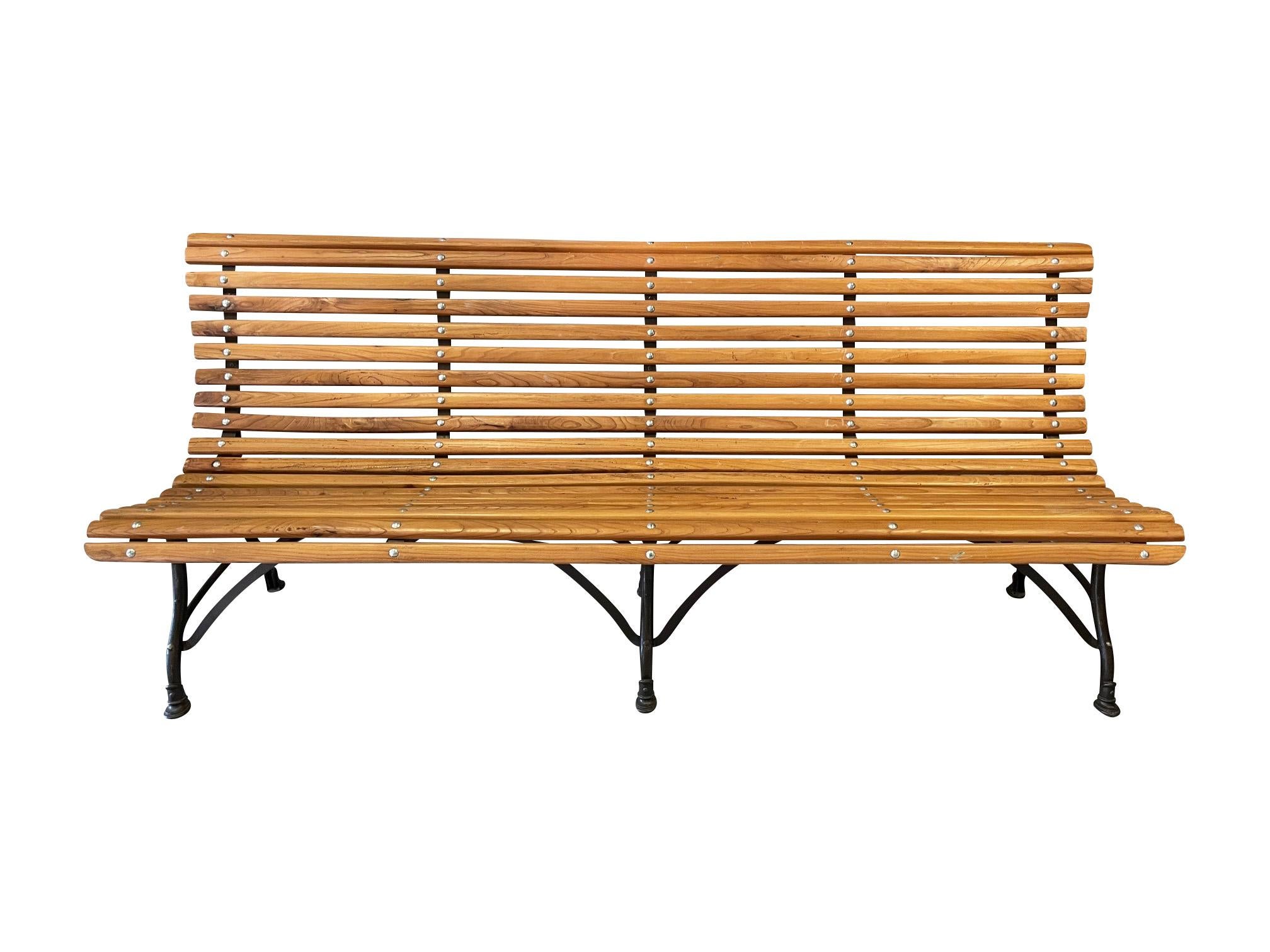 A large Arras wrought iron and timber garden bench, circa 1900.

Refurbished with reclaimed elm slats, a very comfortable and stylish bench from the famous Arras Foundry in Northern France which operated throughout the 19th century, until the
