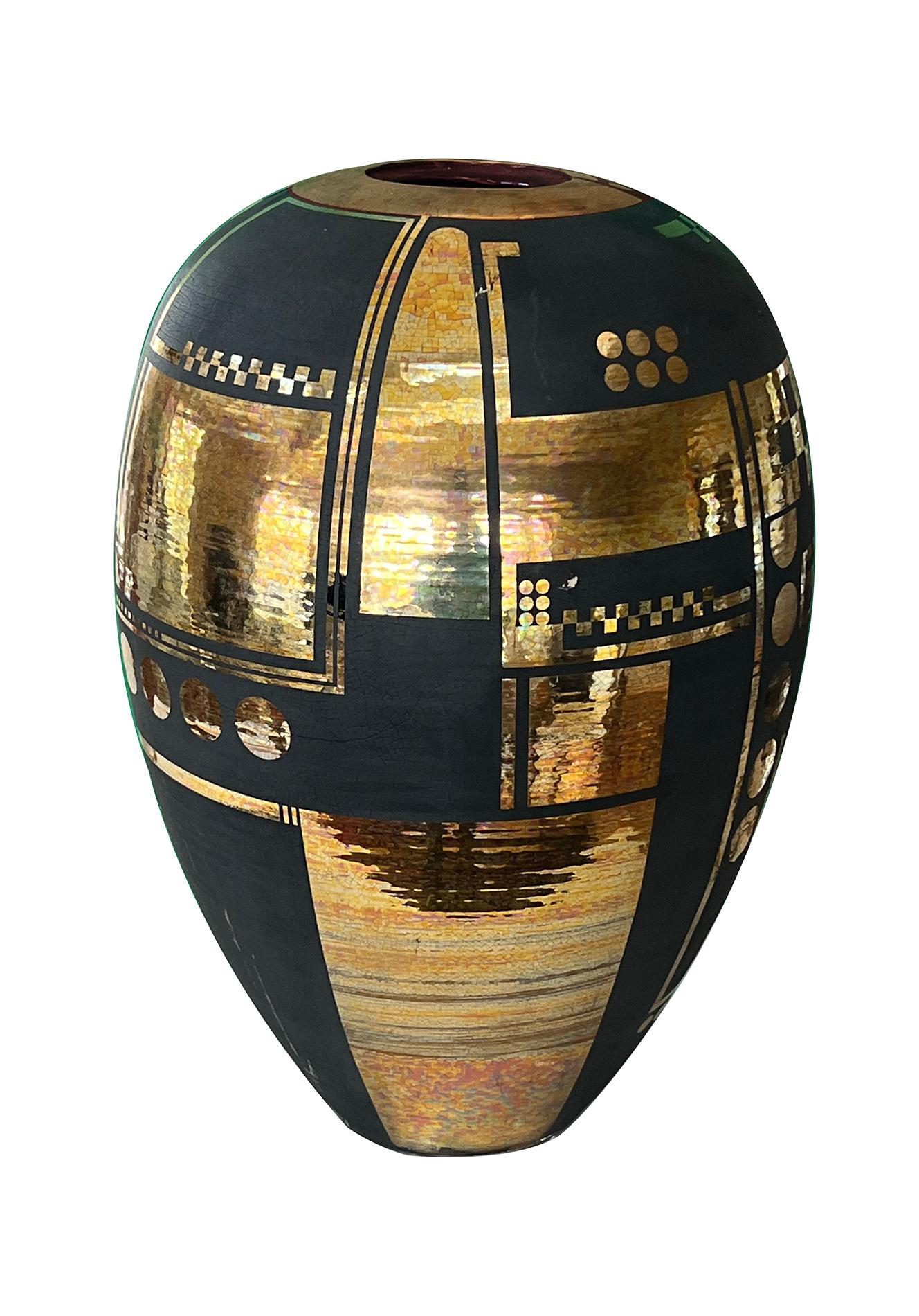 the large ovoid vessel tapering to the base; adorned overall with geometric gilt decoration all on a black matte ground