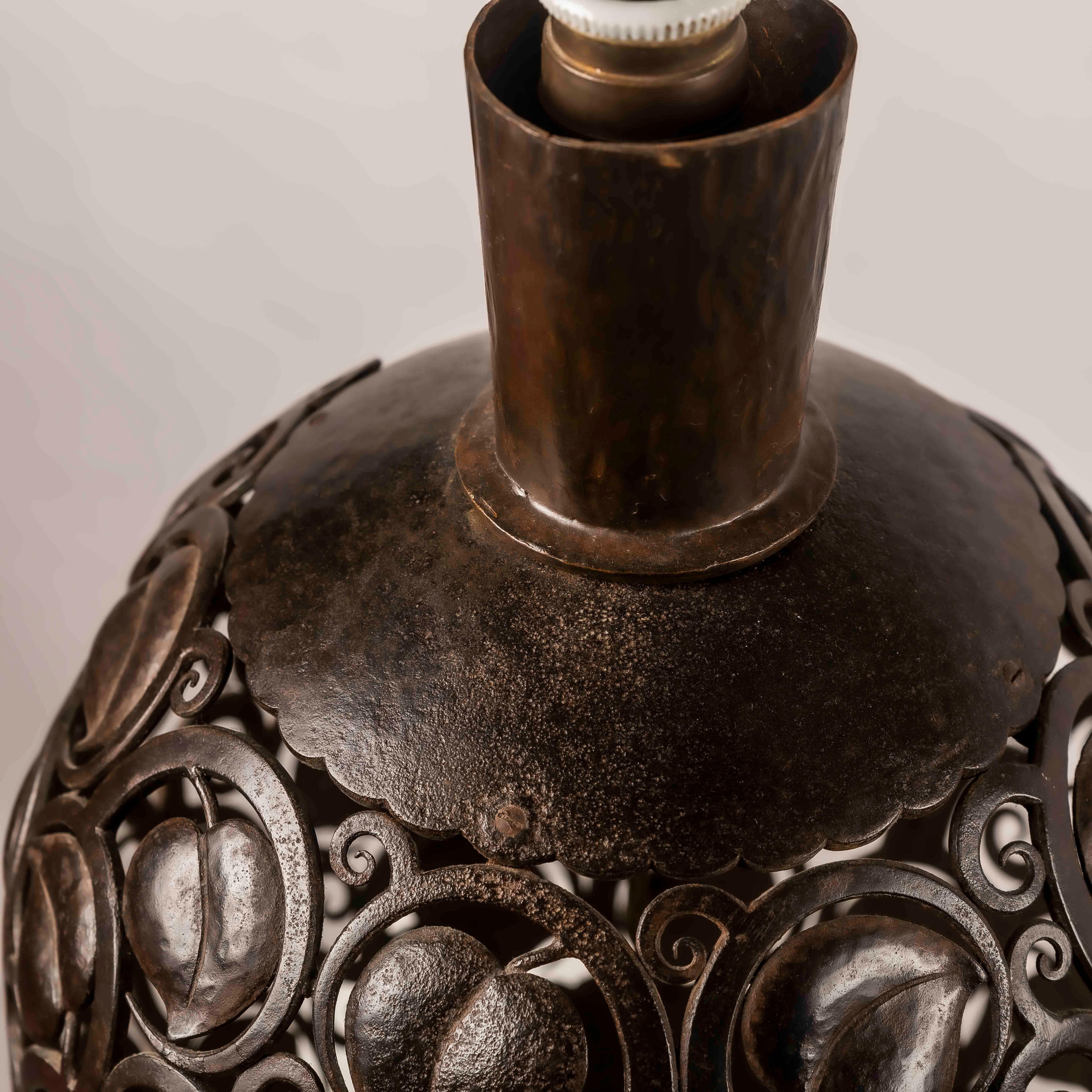 A large Art Deco wrough iron lamp designed by Edgar Brandt, Stamped 