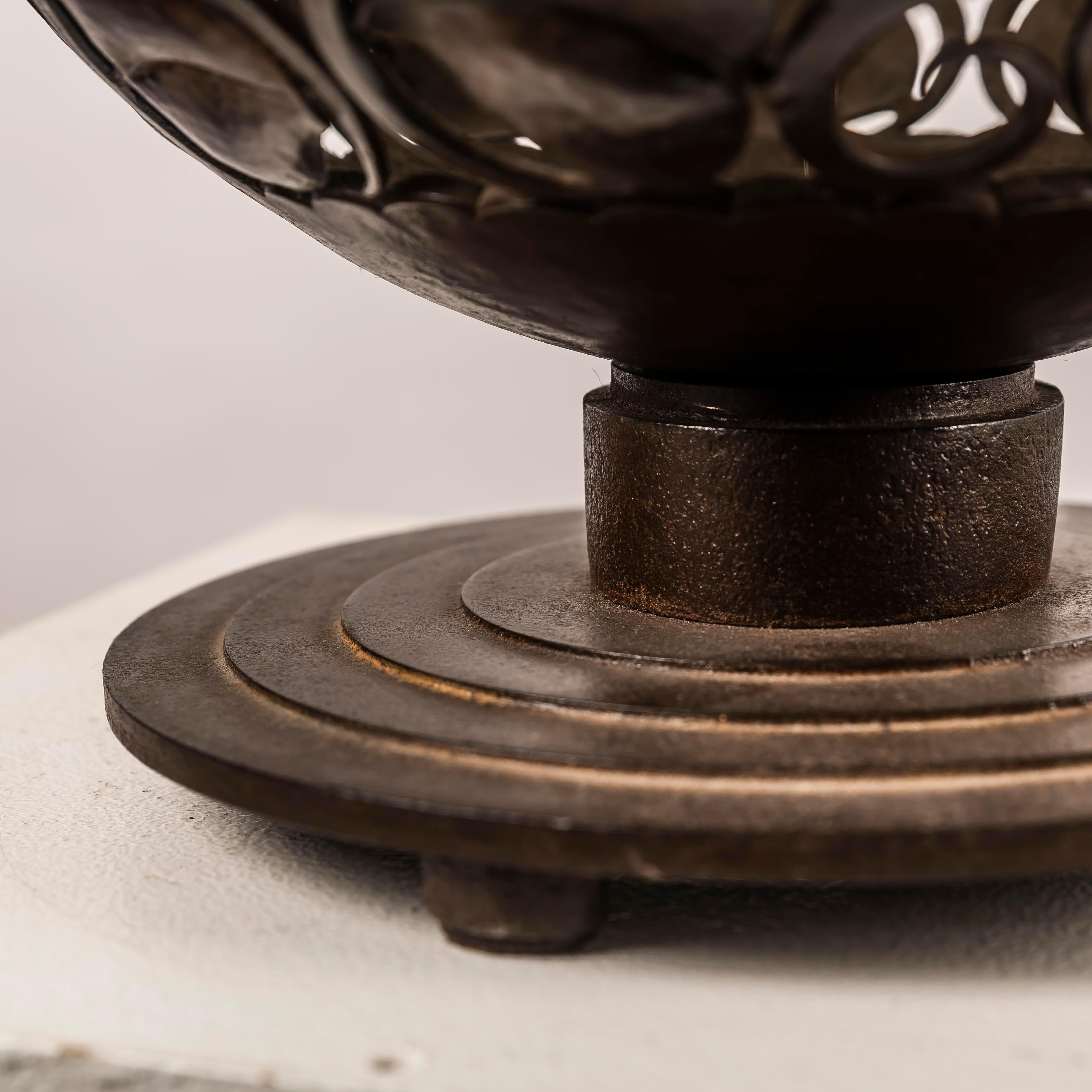 A large Art Deco wrough iron lamp designed by Edgar Brandt, Stamped 