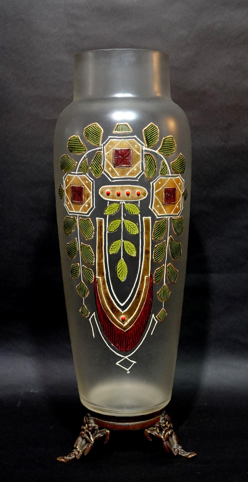 A Large Glass vase of Art Nouveau style with Enameled and Gilt Art Glass Vase in a frosted body formed a very elegant shape with subtle curved lines. The vase sits on a Bronze base.