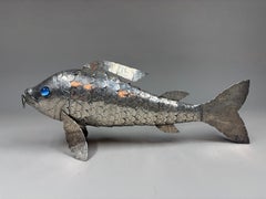 A large articulated silver fish with glass eyes