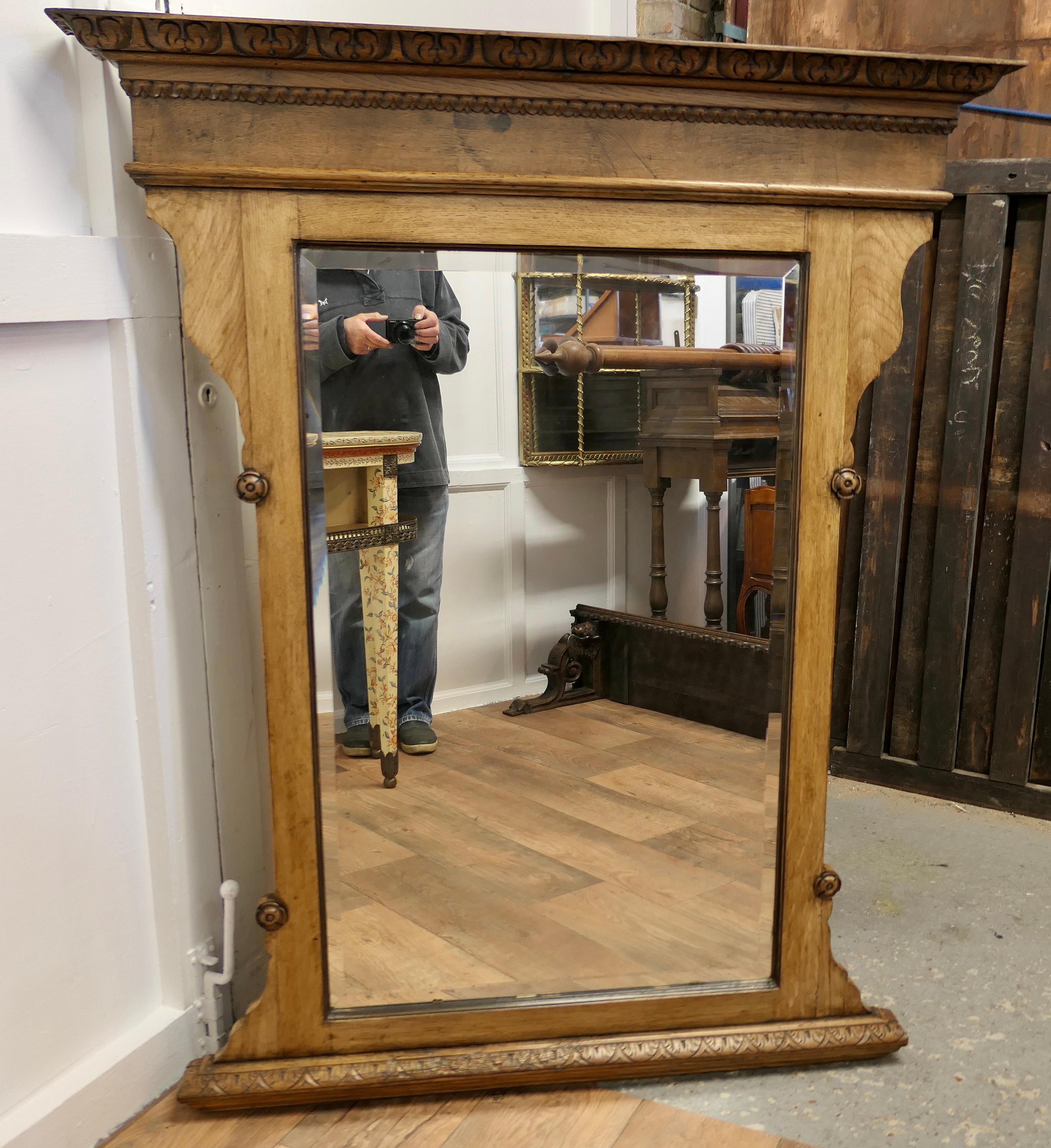 A Large Arts and Crafts 19th Century Light Oak Over Mantle Mirror 


This is a Striking piece it has a rectangular shape with a wide cornice at the top with carving at the top and bottom 
The mirror is in delightful Golden Oak and would set off