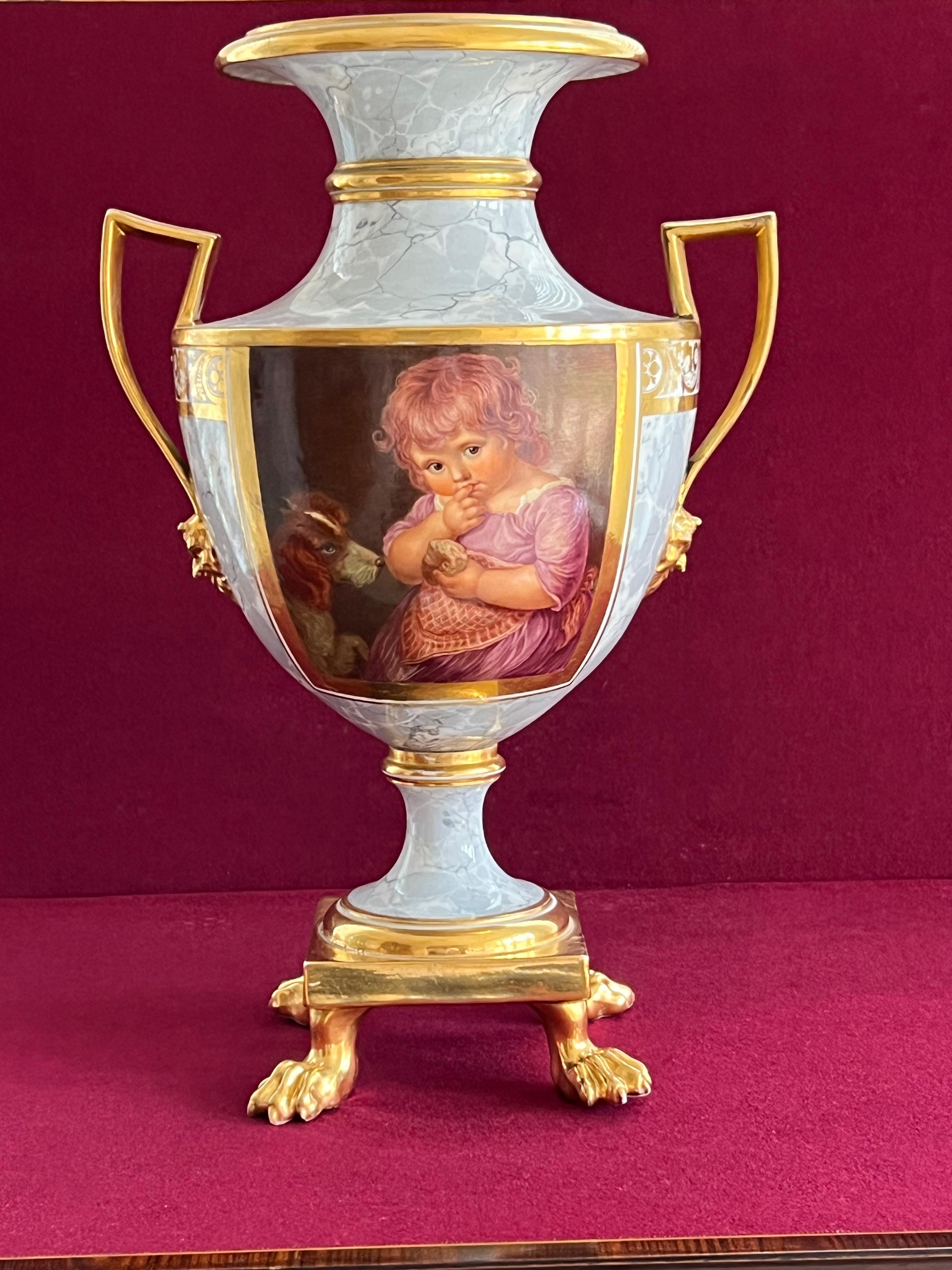 A large Etruscan-shaped barr, flight and barr worcester vase, circa 1810 Probably painted by John Pennington, of generous shield shape, the square strap handles with satyr mask terminals, raised on a square base supported on four gilded lion paw