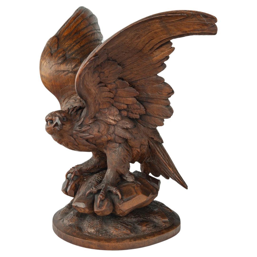 A large Black Forest walnut wooden carving of an eagle For Sale