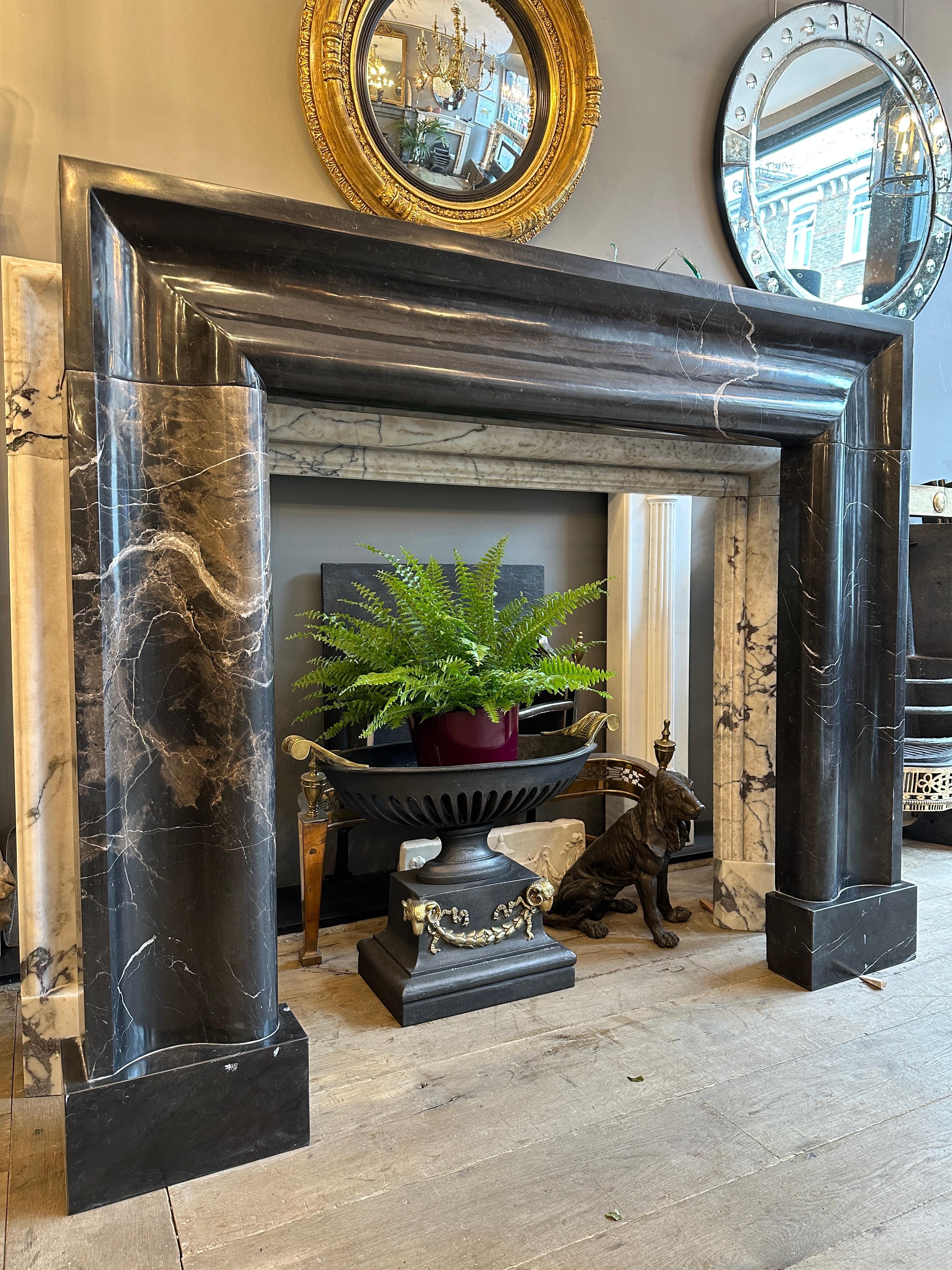 English A Large Black Marble Bolection Fireplace Mantle 