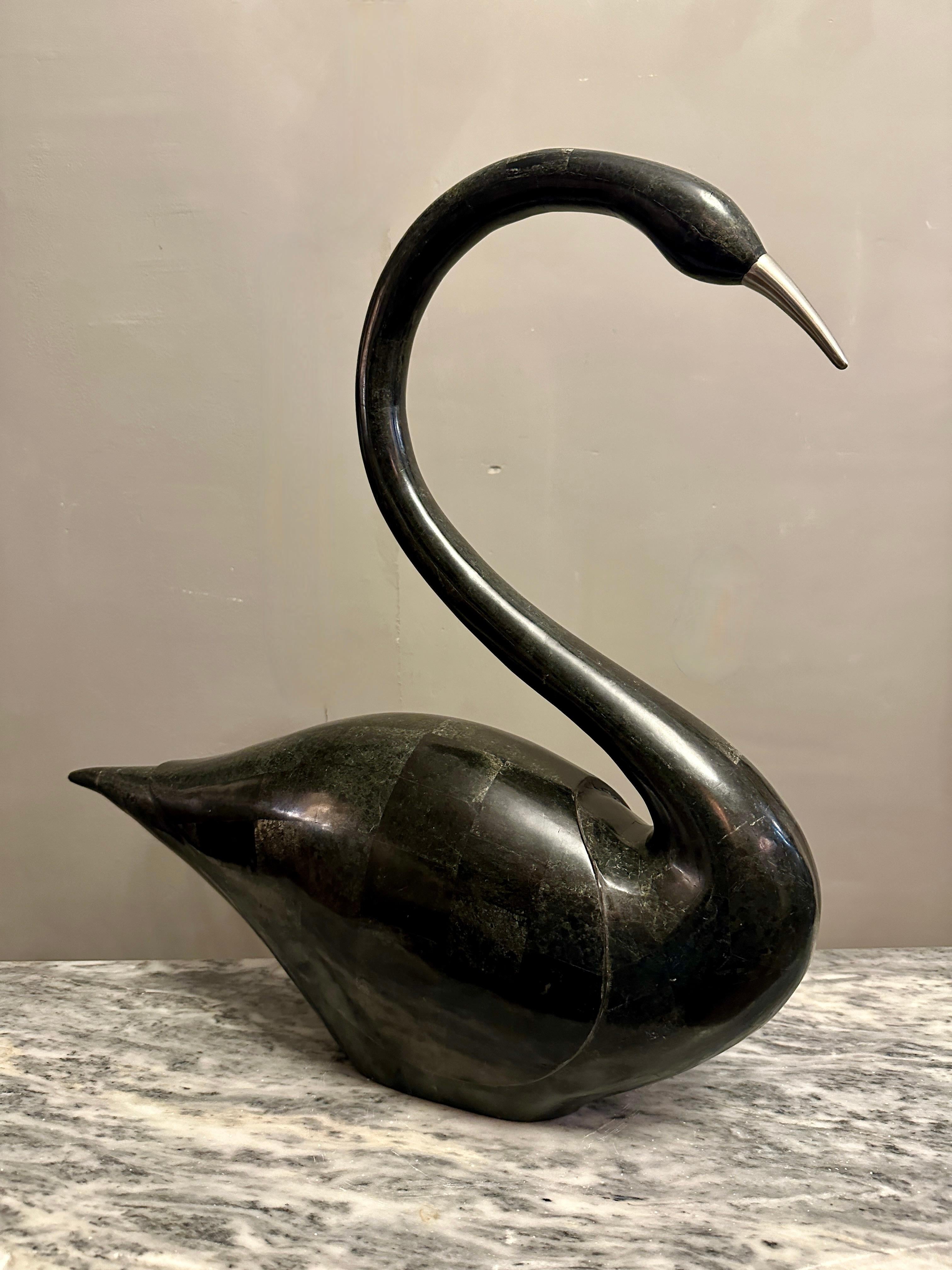 A large tessellated marble stylised swan by Maitland Smith. The black marble used to cover the body with hints of grey. The brass bill intact. In good form and proportions.