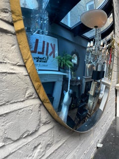 A Large Blue Convex Mirror with distressed finish