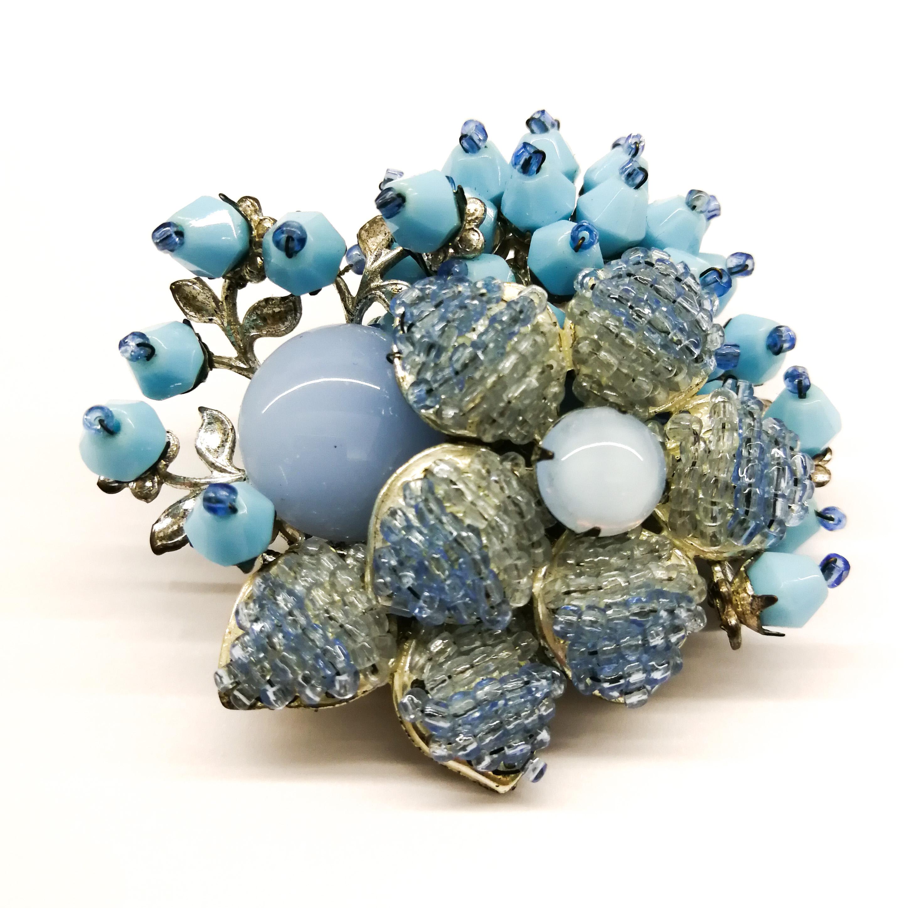 An unusual stylised floral brooch, made from cabuchons , tightly 'knitted' glass beads and unusually shaped opaque beads, from Miriam Haskell, creating a very distinctive look. Perfect for Summer and those carefree occasions, Haskell's quality and