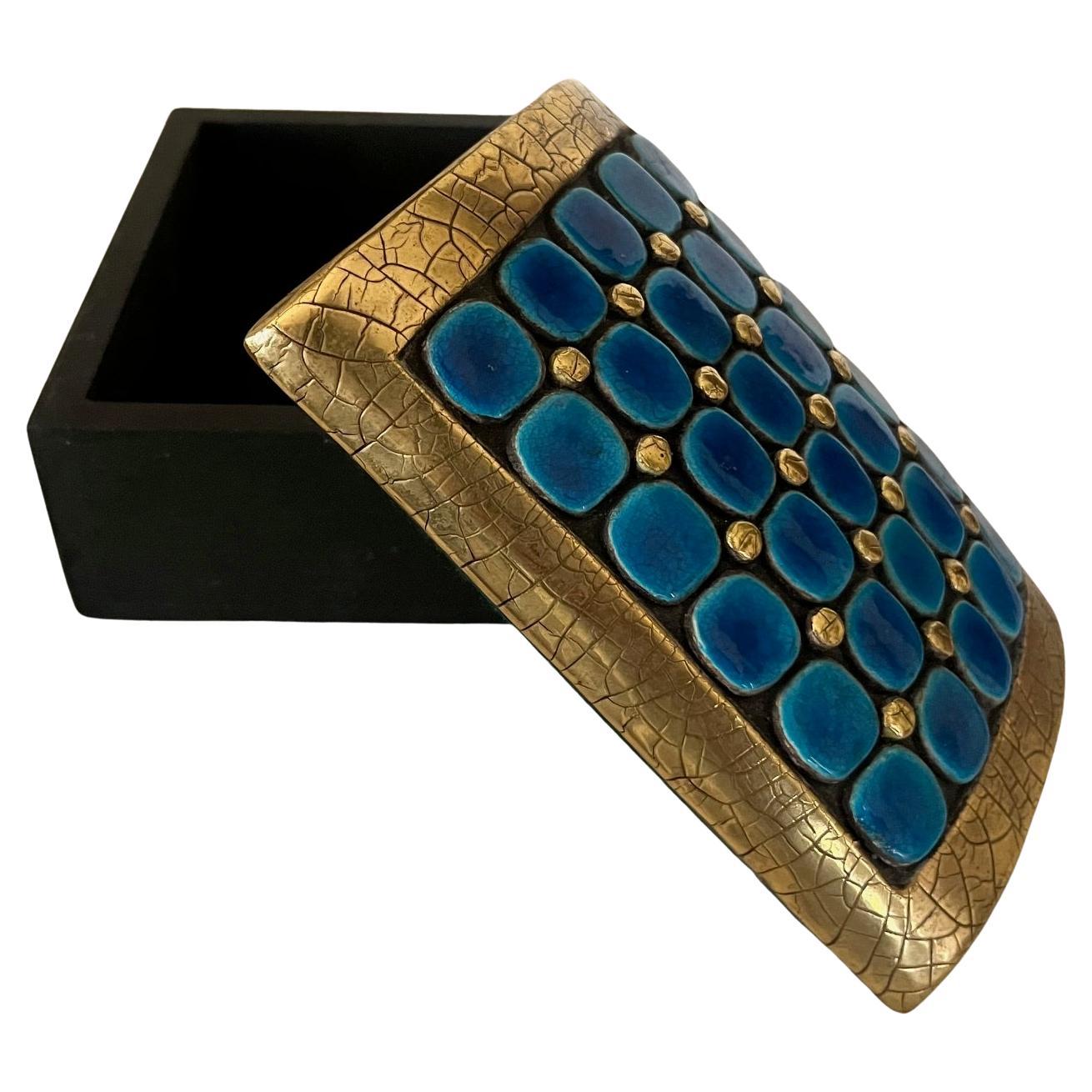 Rare rectangular box with glazed ceramic domed lid. 
 Set of blue and gold points, framed with crackled gold . 
The box in black painted wood.
Original felt lining at the bottom of the box and under the lid.
Mithé Espelt  ( 1923-2000 ) 
Lunel, 