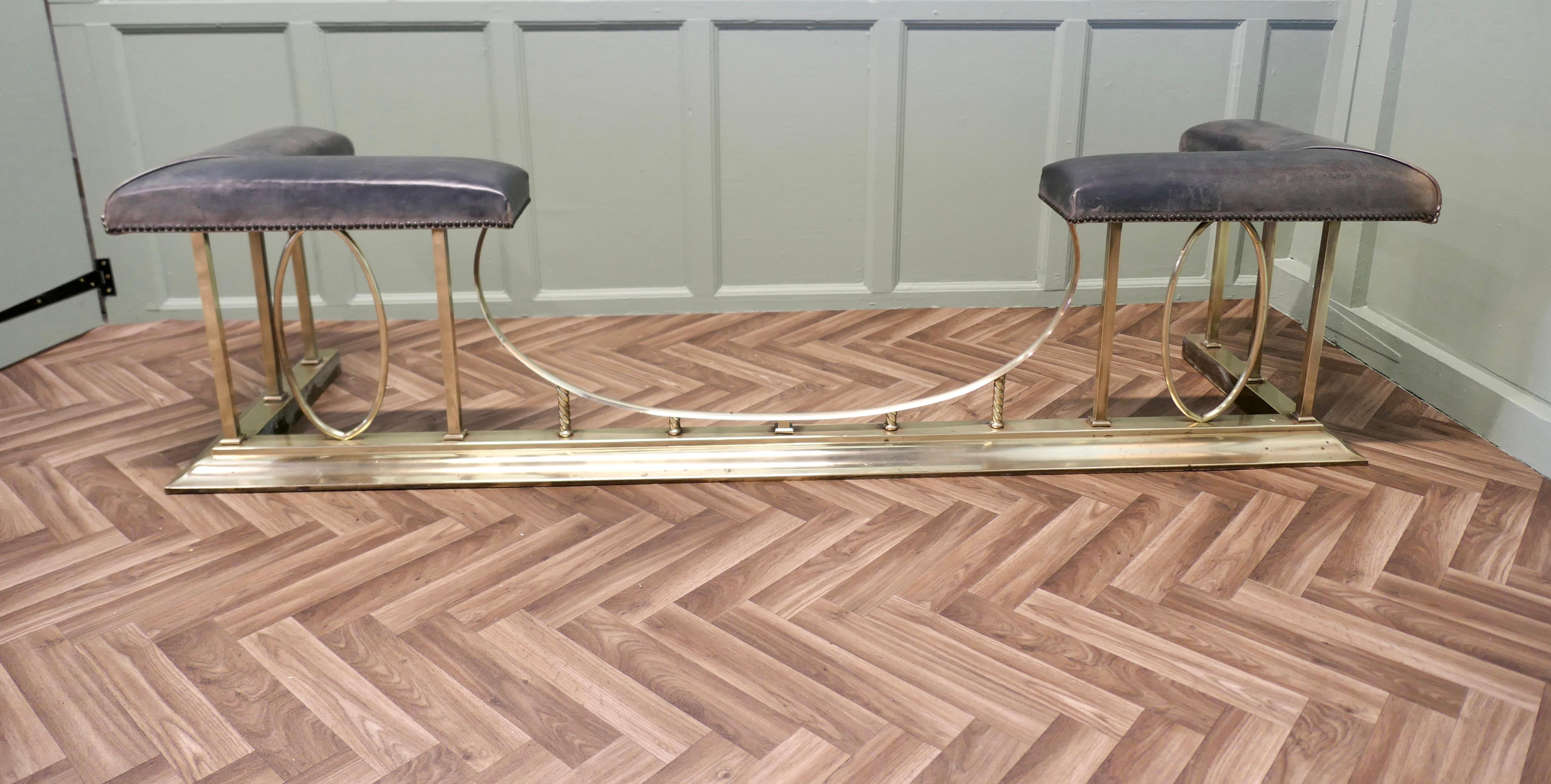 A Large Brass and Leather Club Fender

This is an elegant piece of country House Furniture the seats have developed a charming look of their own, they have been upholstered with a hand dyed leather which has a wonderful look, it is slightly silver