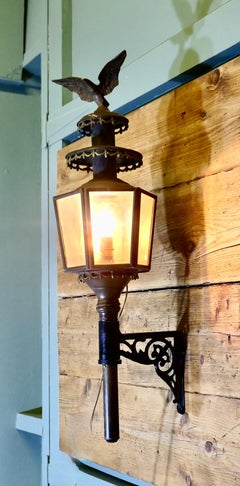 A Large Brass Carriage Light with Eagle, Wall light