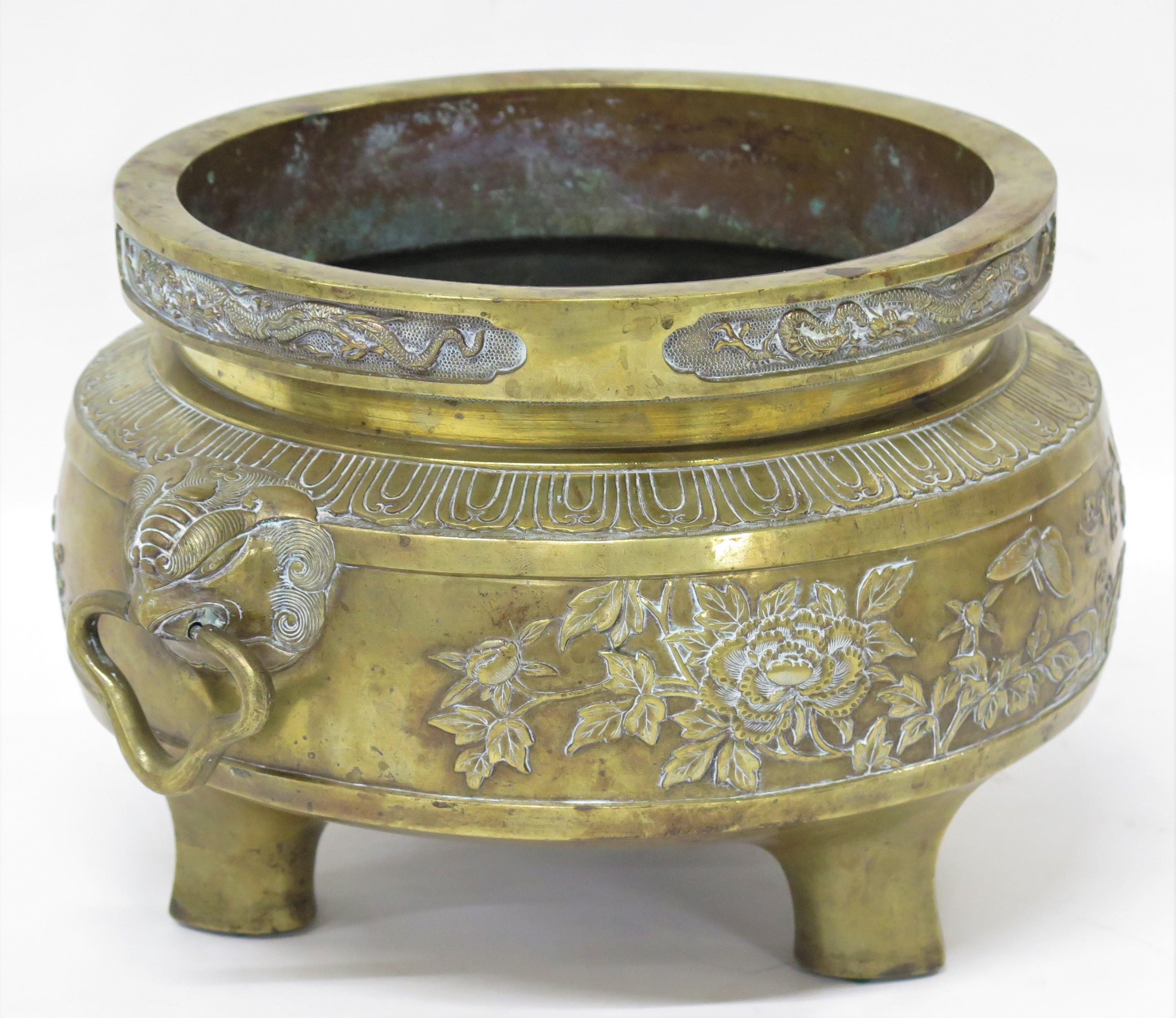 Chinoiserie A Large Brass Container with Three Feet
