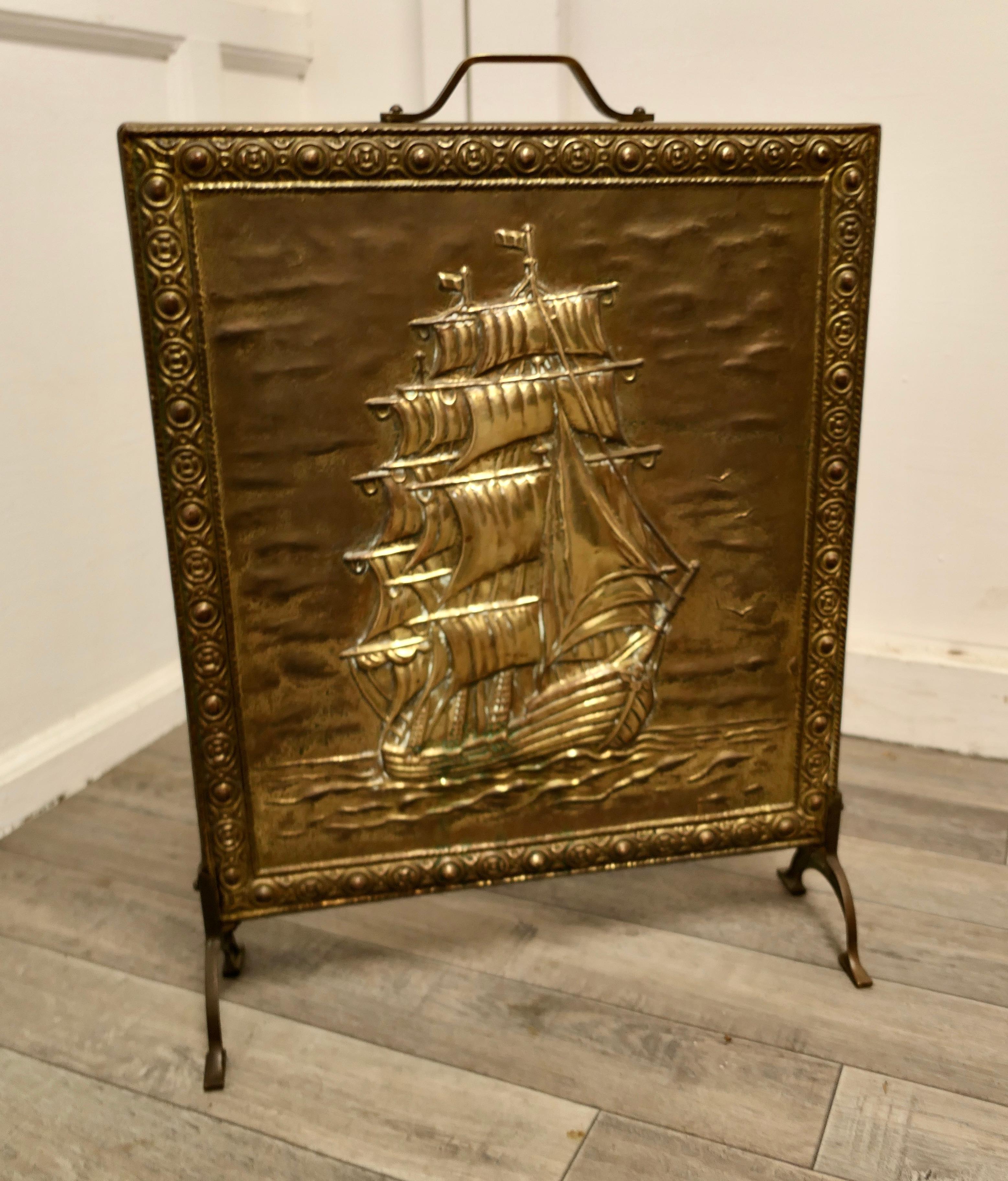 A large brass fire screen with the Cutty Sark

This is a large fire screen it has a very attractive picture on the front of the famous cutty sark in full sail
The screen is good quality and made in brass with a handle to the top, 
The screen is