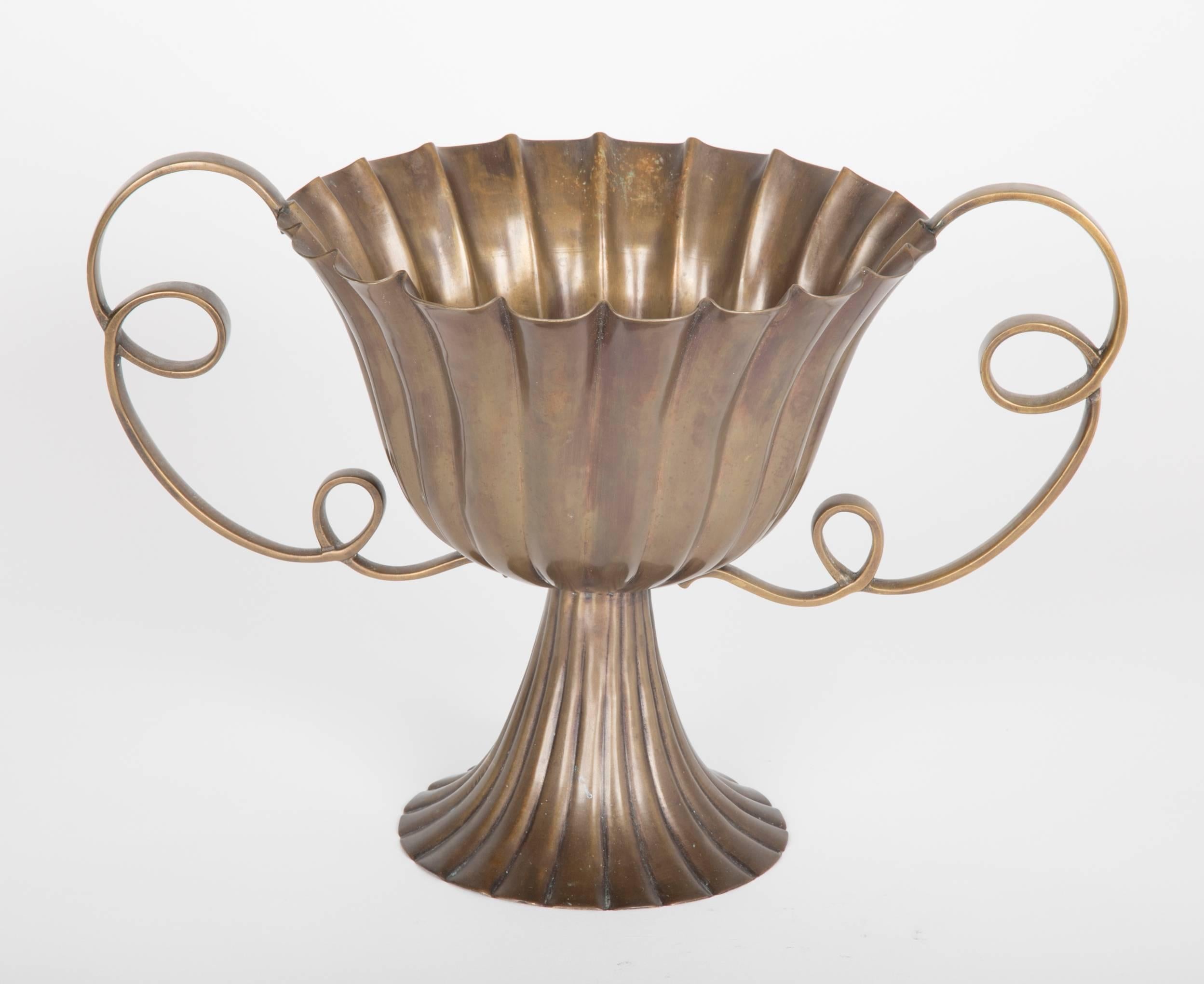 A large presumably handmade urn form vessel in the manner of Josef Hoffman.