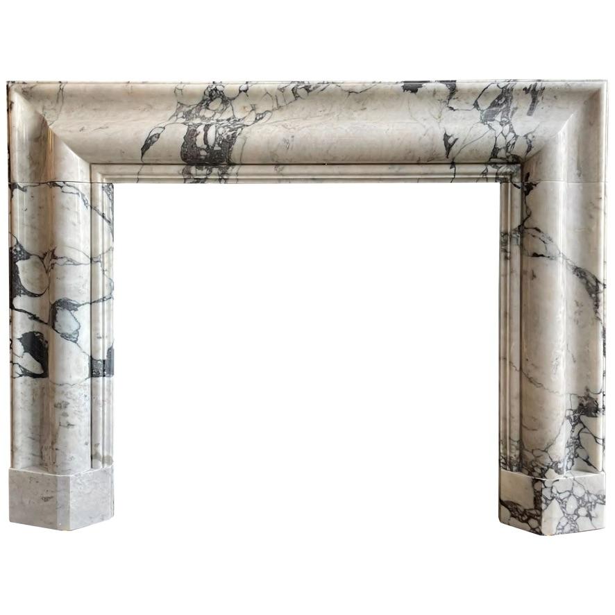 A large reclaimed Bolection fireplace surround in quality Italian Breche marble. The header and jambs with a wide yet deep bolection moulding, stepped and moulded inner slip with shaped foot blocks. In very good order. 

Opening Size 
109cm w x 95cm