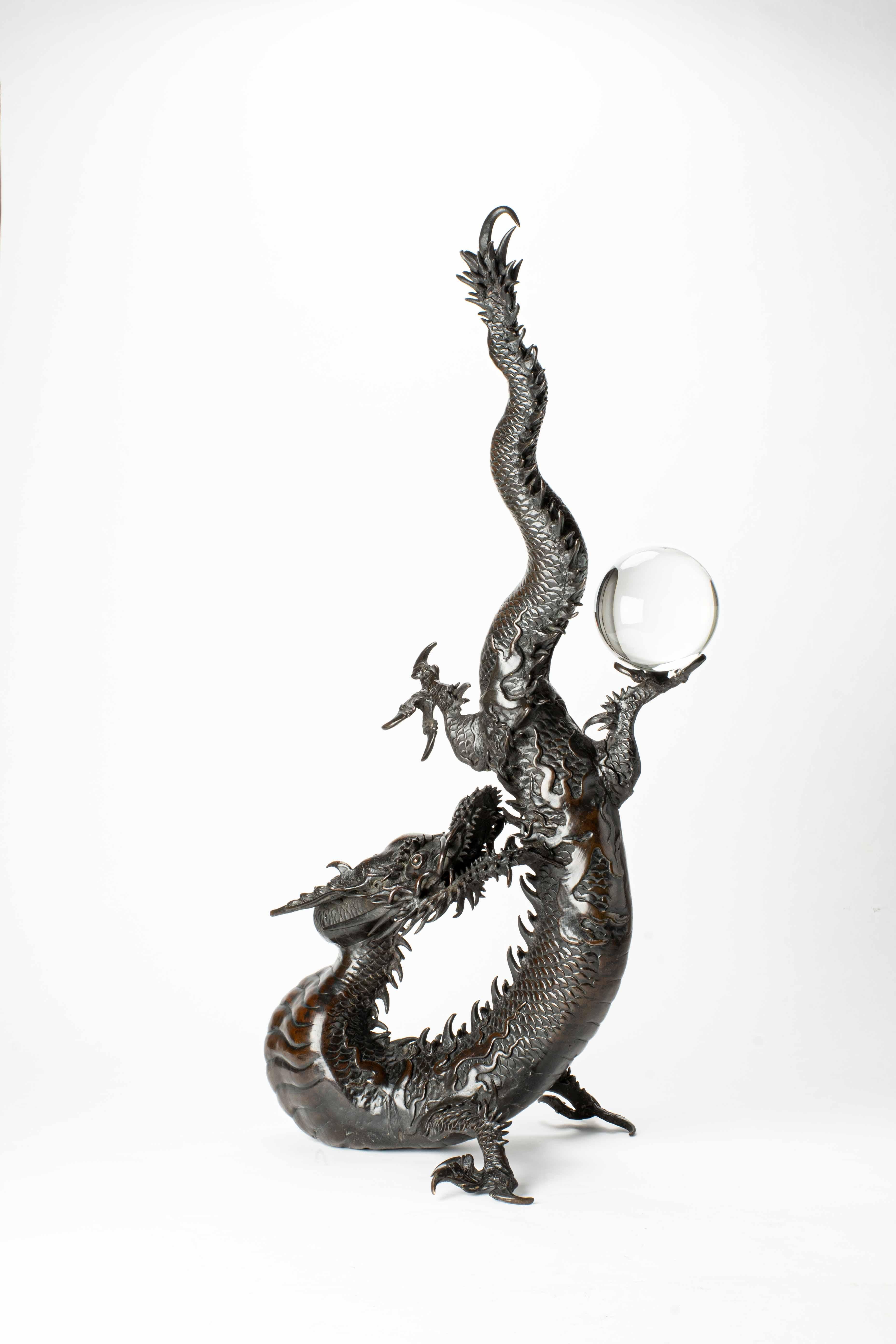 A large bronze okimono depicting a dragon standing upwards with its head stretched forward and its jaws wide open, while holding a crystal sphere aloft.
Work published in the volume “Selezione 2023“.

Unsigned
Height: 75 cm
Edo, c. 1850