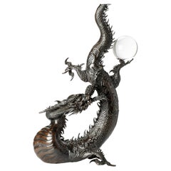A large bronze okimono depicting a dragon