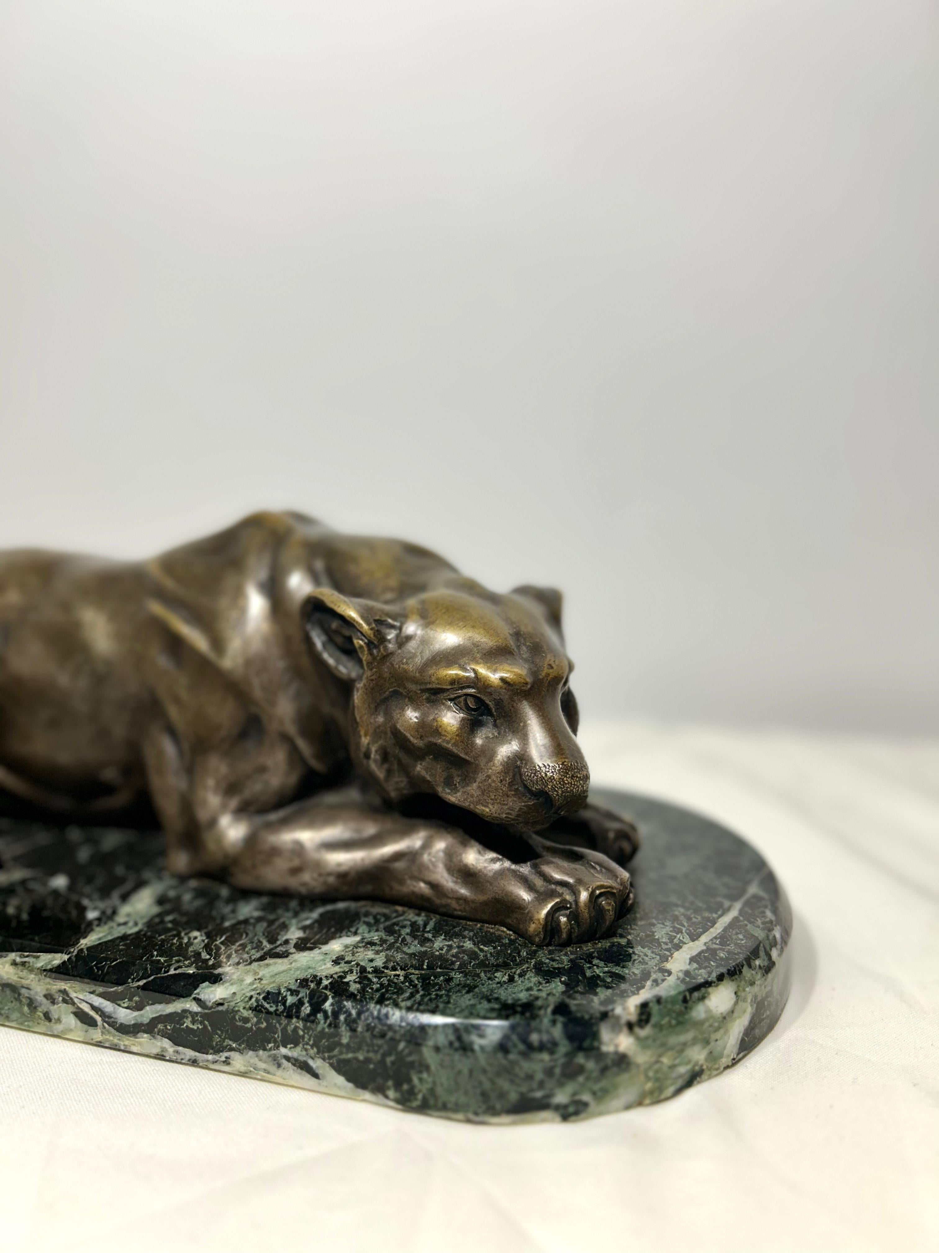 19th Century Large Bronze Sculpture Depicting a Recumbent Lioness Mounted on a Marble Based