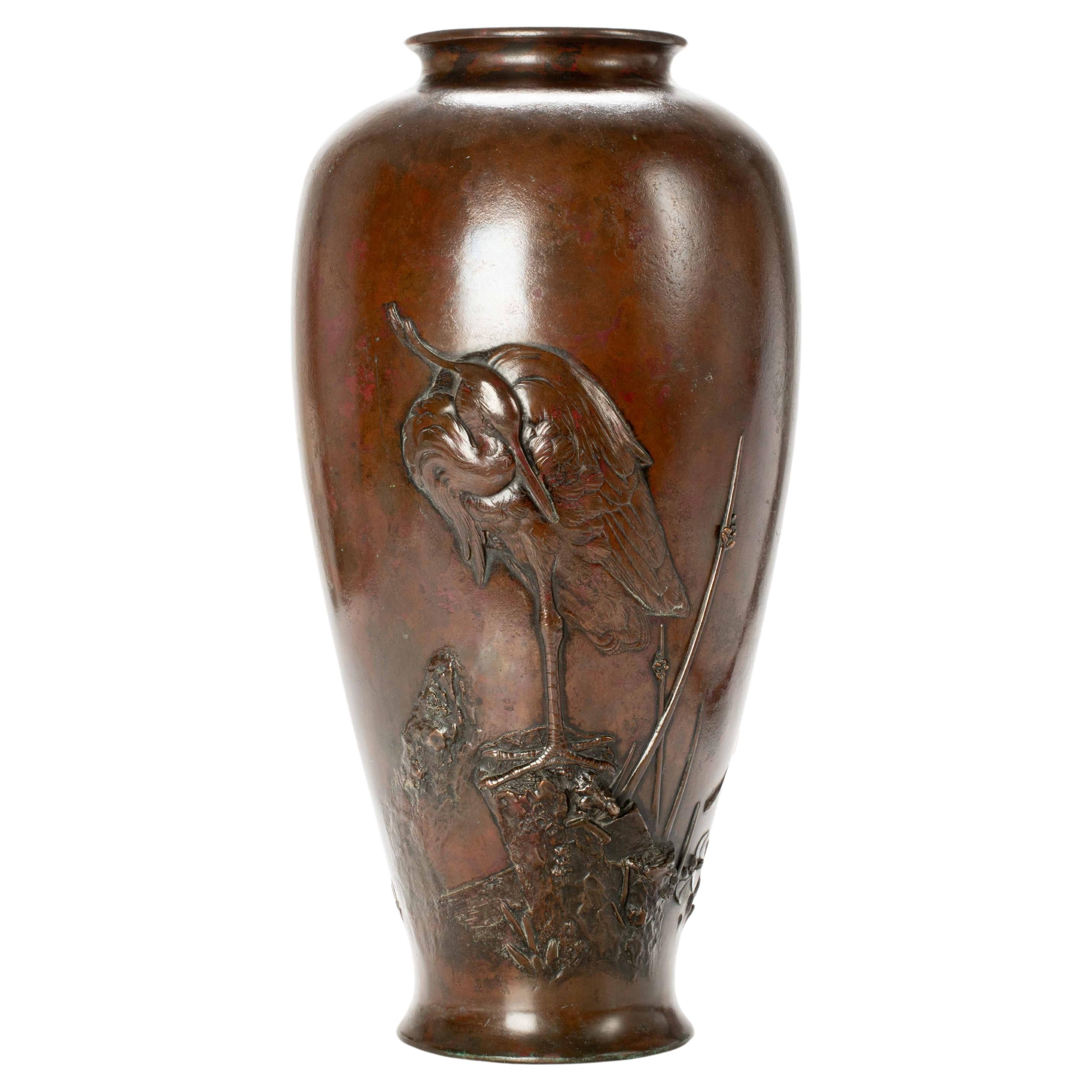 A large bronze vase depicting an egret For Sale