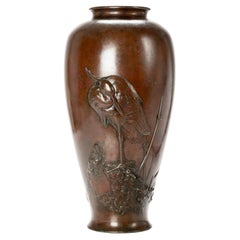 Antique A large bronze vase depicting an egret