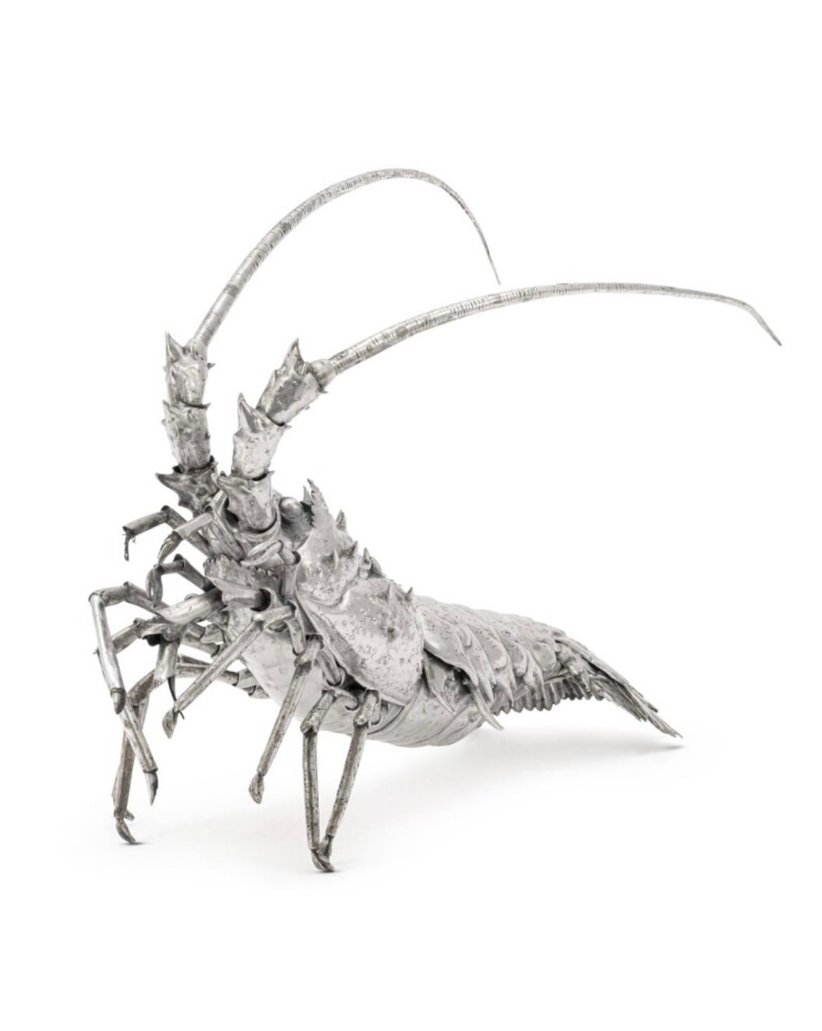 Un grande modello in argento di Buccellati di un'aragosta realistica

Realizzato con grande maestria per catturare l'essenza dell'aragosta vera, questo modello è caratterizzato da dettagli squisiti e da un realismo realistico.

Ogni segmento