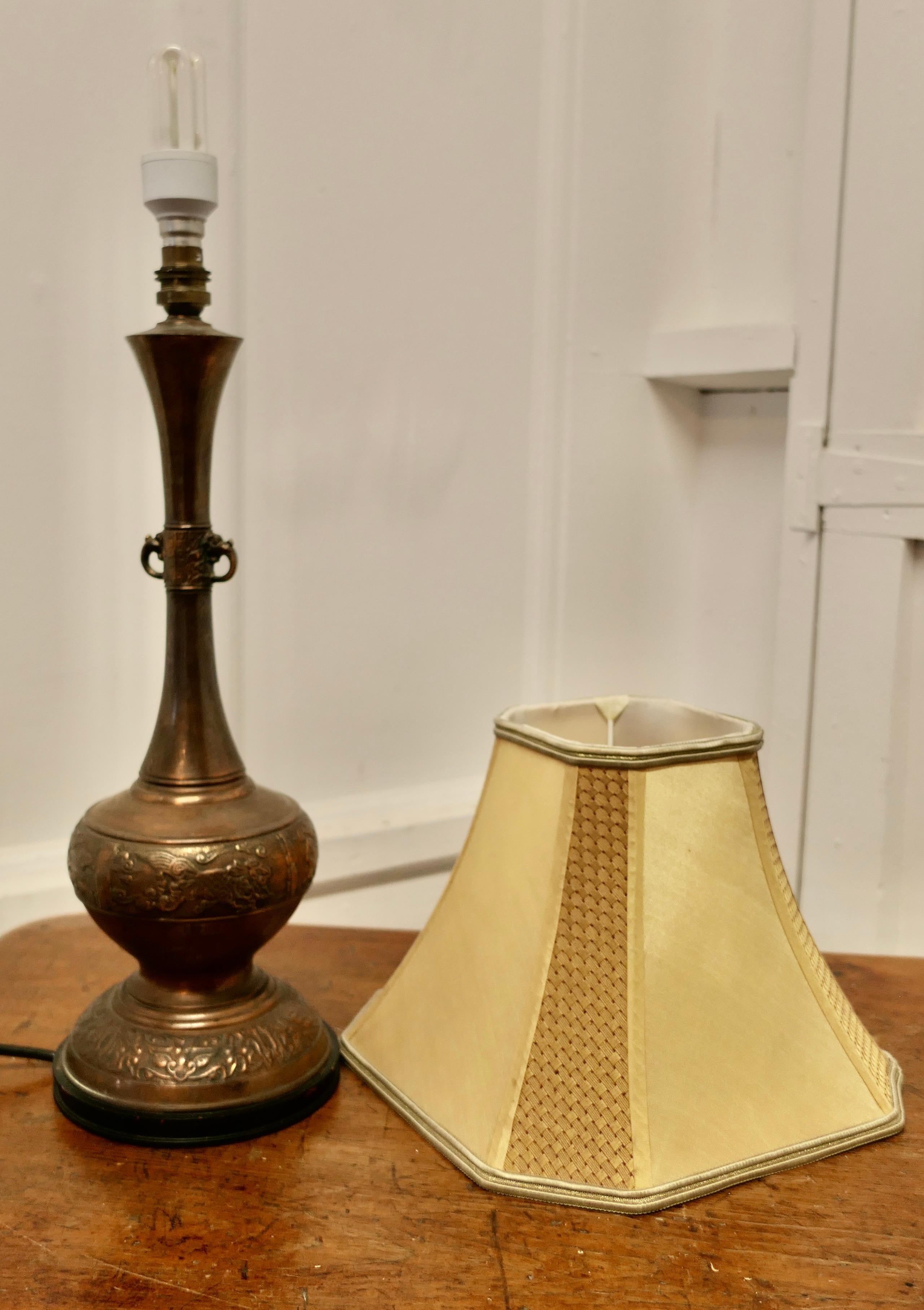 Mid-20th Century A Large Bulbous Embossed Copper Table Lamp     For Sale