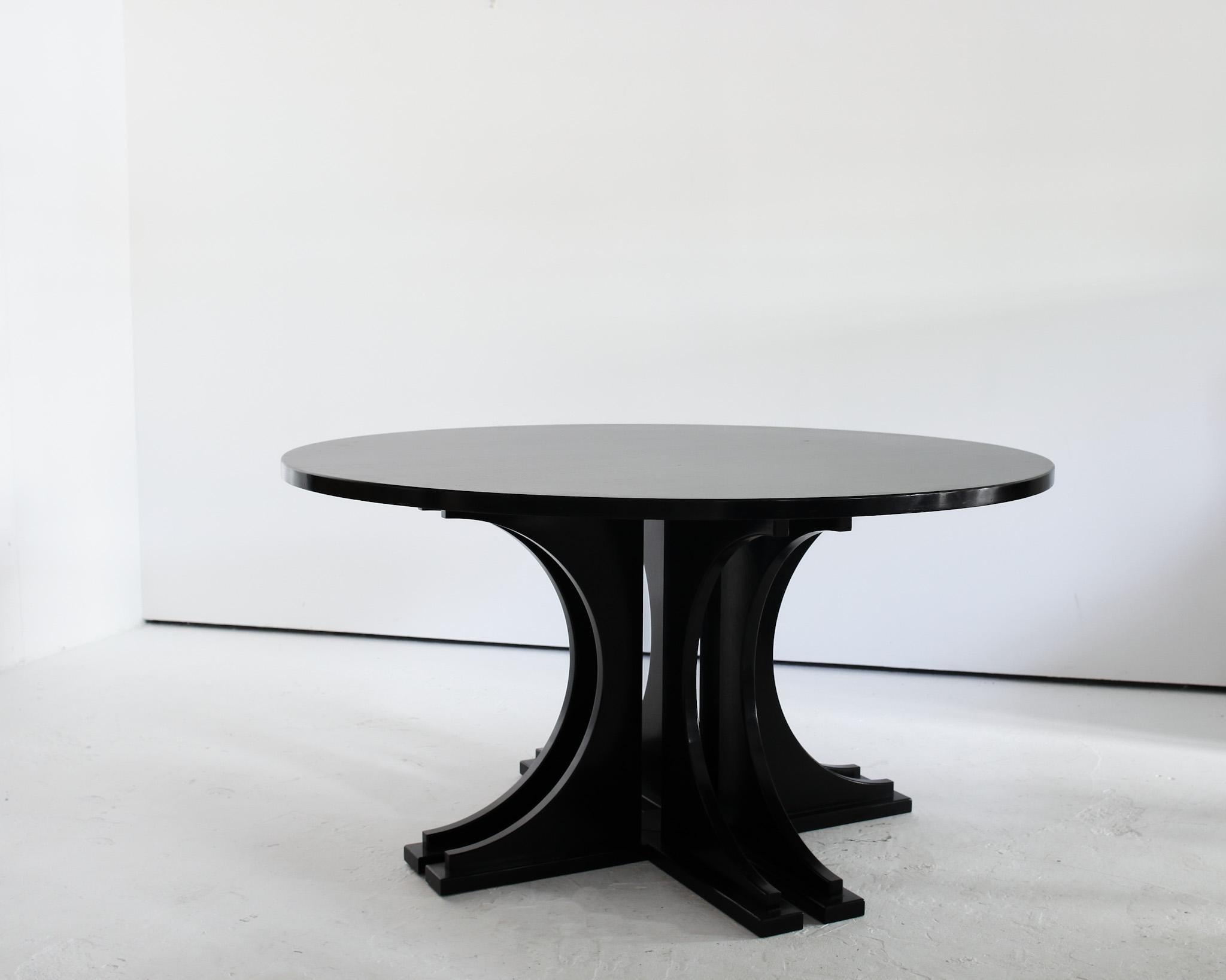 A large ebonised circular centre/dinning table from Italy

Unusual C.1970s design with impressive sculptural base.