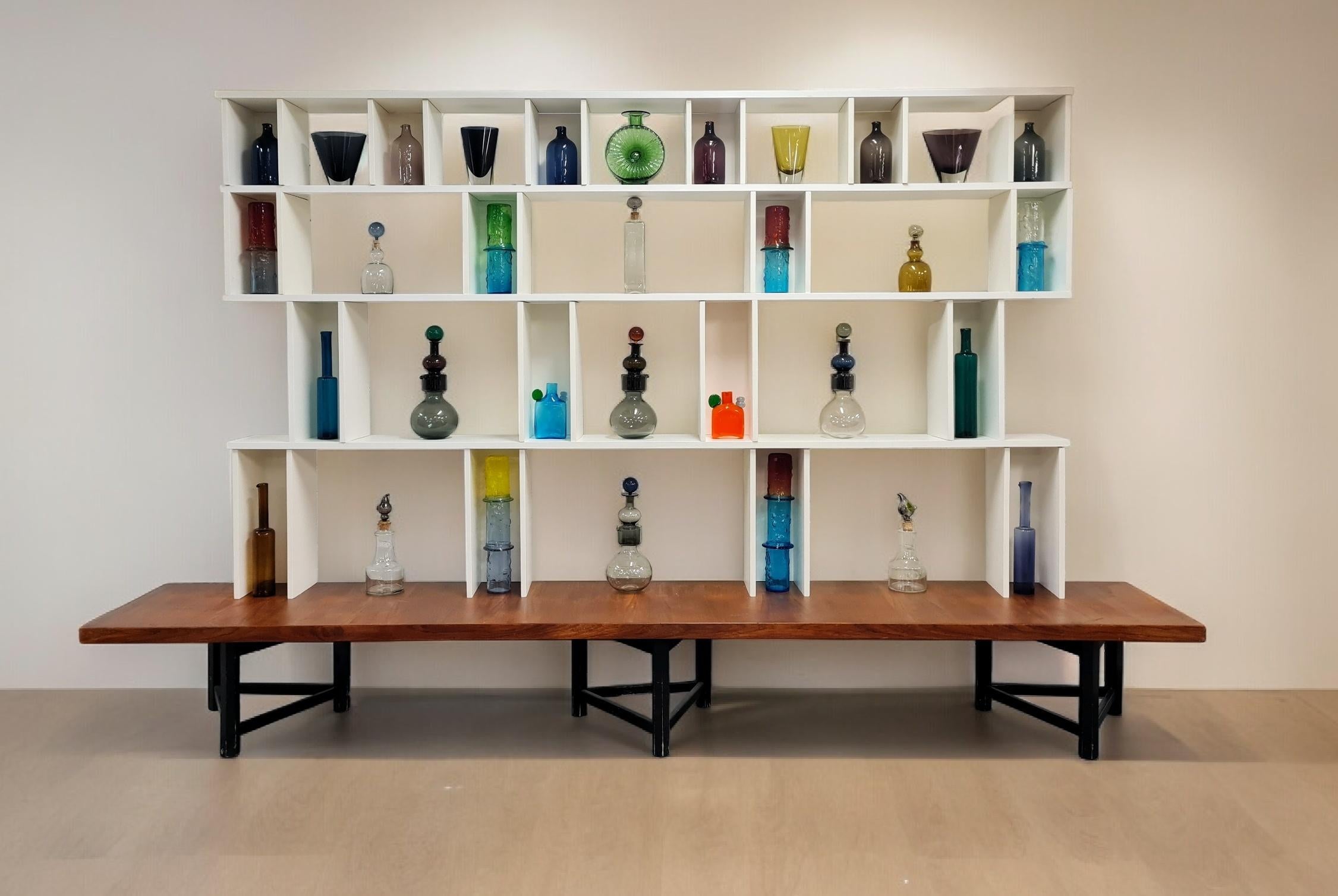 Hiort af Ornäs designed this type shelf in the 1950s. It is called the `Välipala hylly` in Finnish, and it has become a classic a long time ago. Actually, it has been taken again into production just recently. 

This is a very simple, practical and